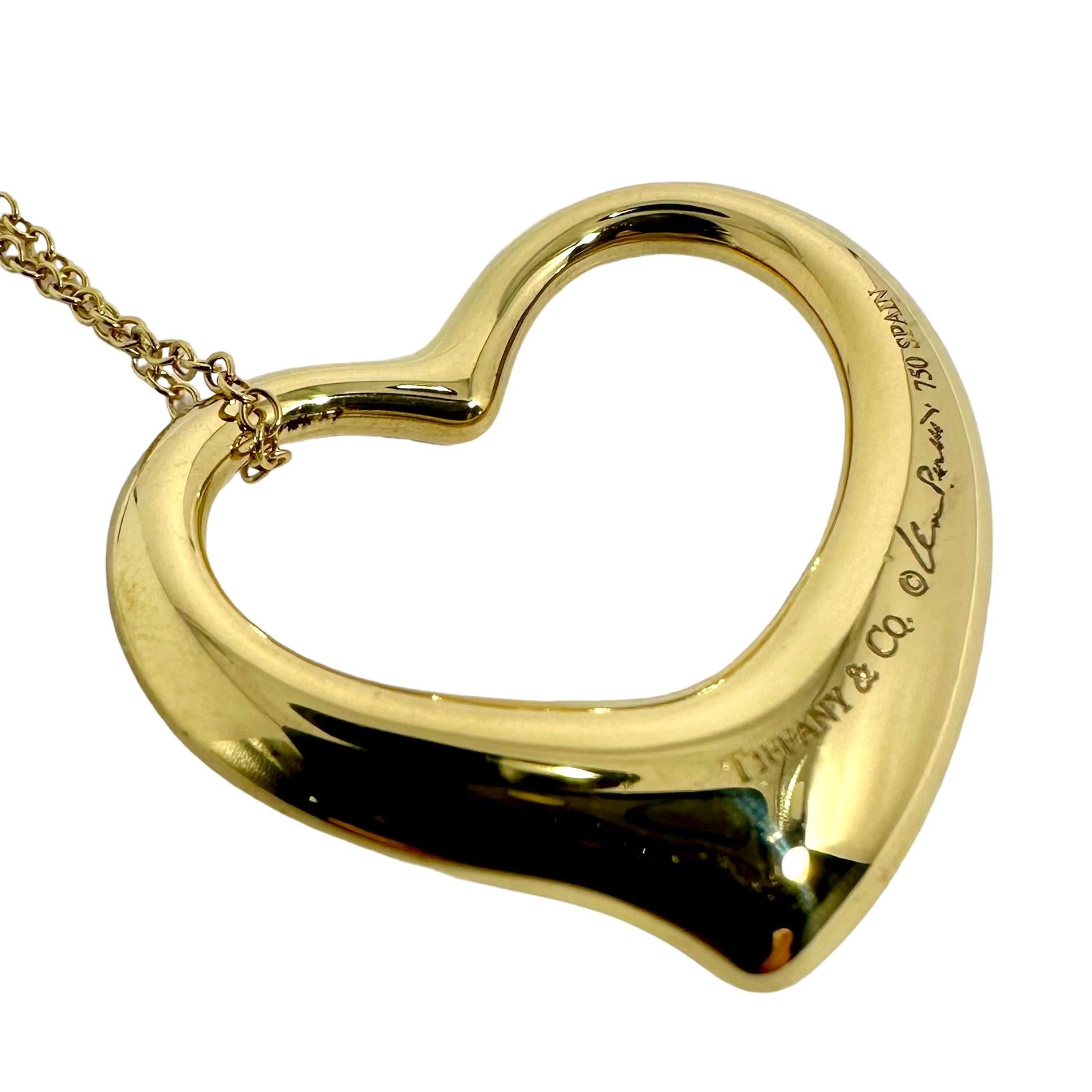 This wonderful vintage Tiffany & Co. Elsa Peretti large open heart pendant on 30 inch Tiffany & Co. Elsa Peretti neck chain is a real icon of this venerated house's pendants. It is offered for sale in it's original Tiffany & Co box. This particular