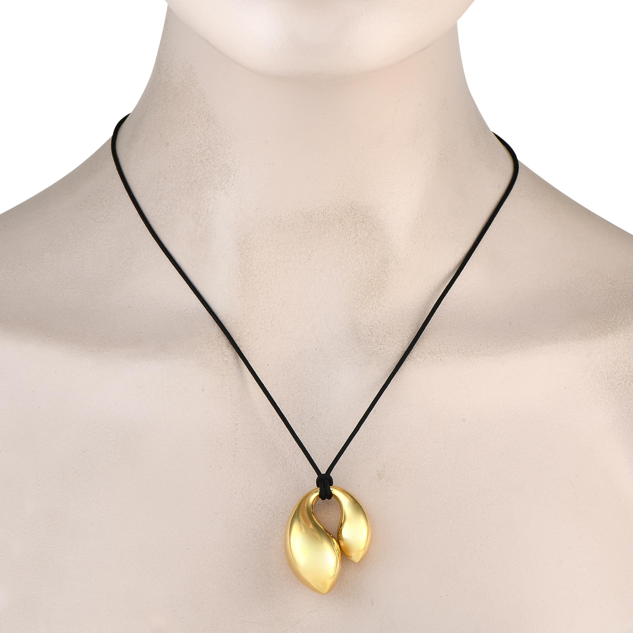 This extra-large double teardrop pendant is a popular design from the late 1970s by the legendary Elsa Peretti for Tiffany & Co. Crafted in solid 18K yellow gold, the pendant features two polished fluid forms that gently connect together. The gold