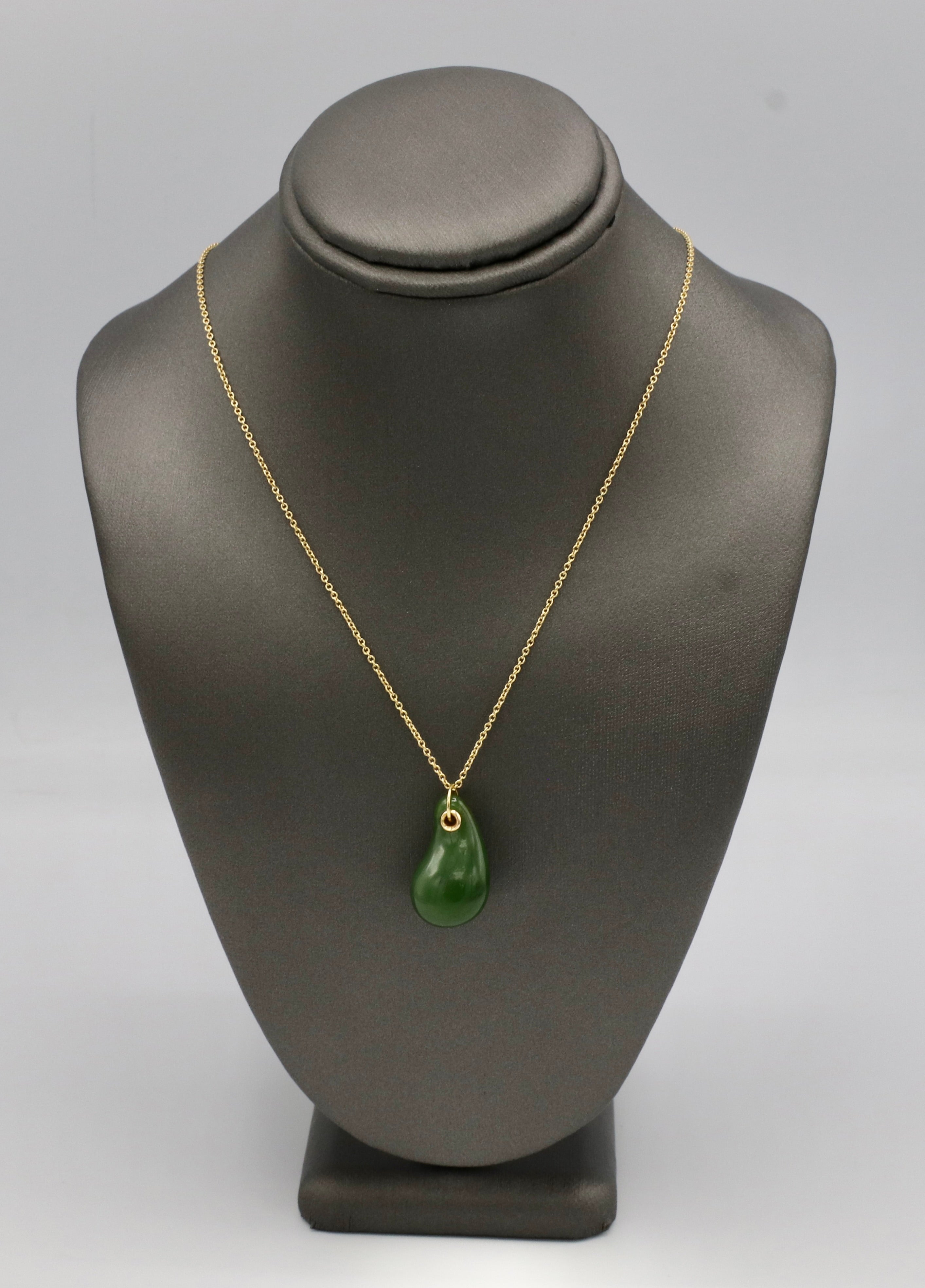 Tiffany & Co. Elsa Peretti 18K Yellow Gold Nephrite Teardrop Pendant Necklace
Metal: 18k yellow gold
Weight: 5.11 grams
Pendant: 21.5 x 12.5mm
Chain: 16 inches
Signed: TIFFANY & CO. PERETTI 750