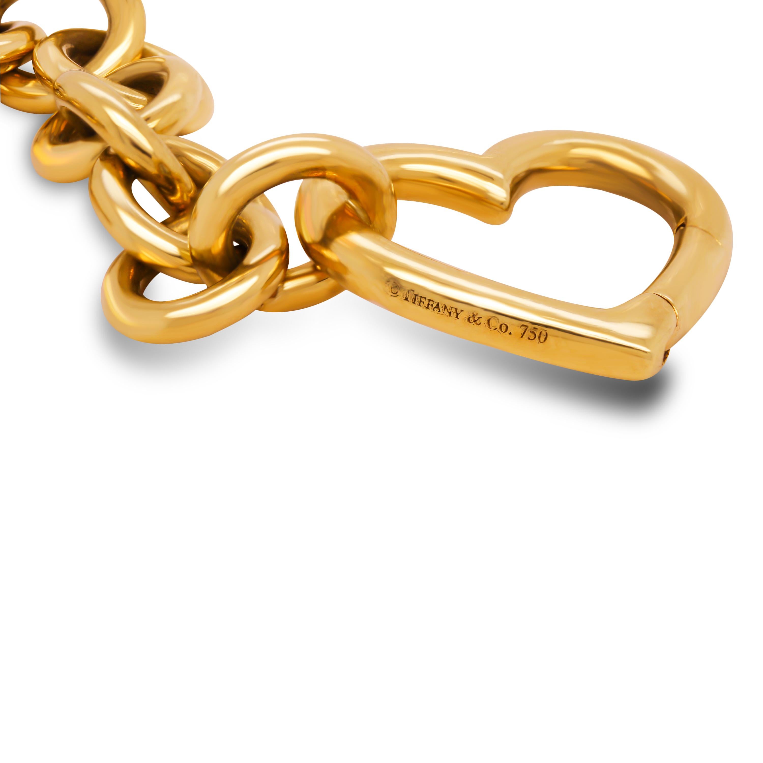 Tiffany & Co. Elsa Peretti 18K Yellow Gold Open Heart Charm Link Bracelet

Bracelet is crafted in solid 18k yellow gold with large style links and the signature open heart charm.

The charm locks and unlocks which allows the bracelet to clasp on