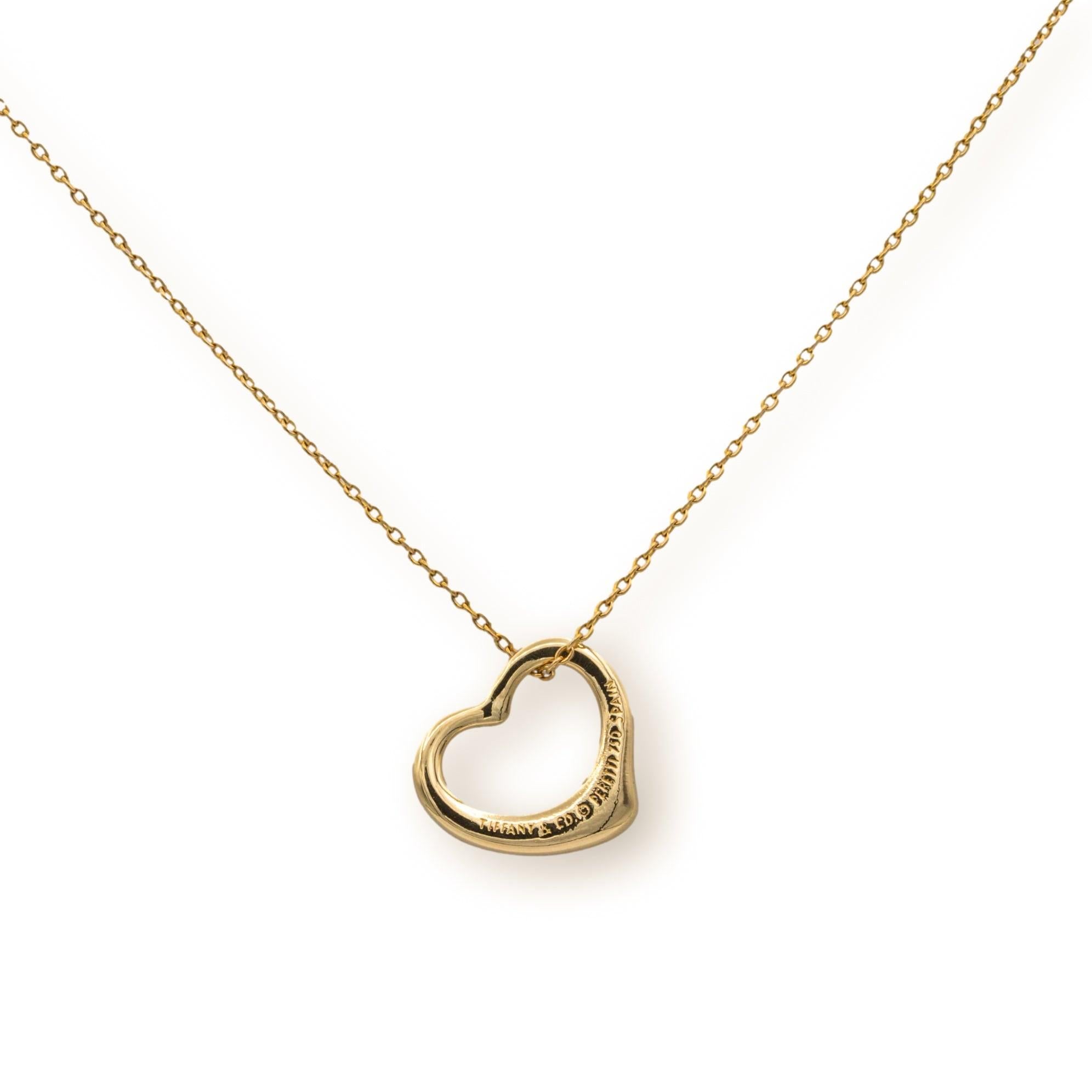 Elsa Peretti for Tiffany & Co. open heart pendant necklace finely crafted in 18 karat yellow gold with a 20” cable link chain with spring ring closure. The heart pendant measures 16mm.

NECKLACE  SPECIFICATIONS:
Hallmarks: Tiffany & Co. Peretti