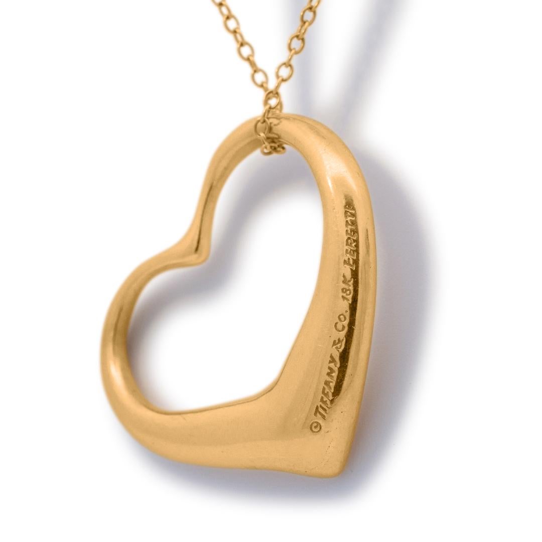 Lady's TIFFANY & CO. ELSA PERETTI polished 18K yellow gold single strand matinee, necklace. The necklace measures approximately 30.00 inches in length by 36.00mm in width and weighs a total of 13.53 grams. Engraved with 