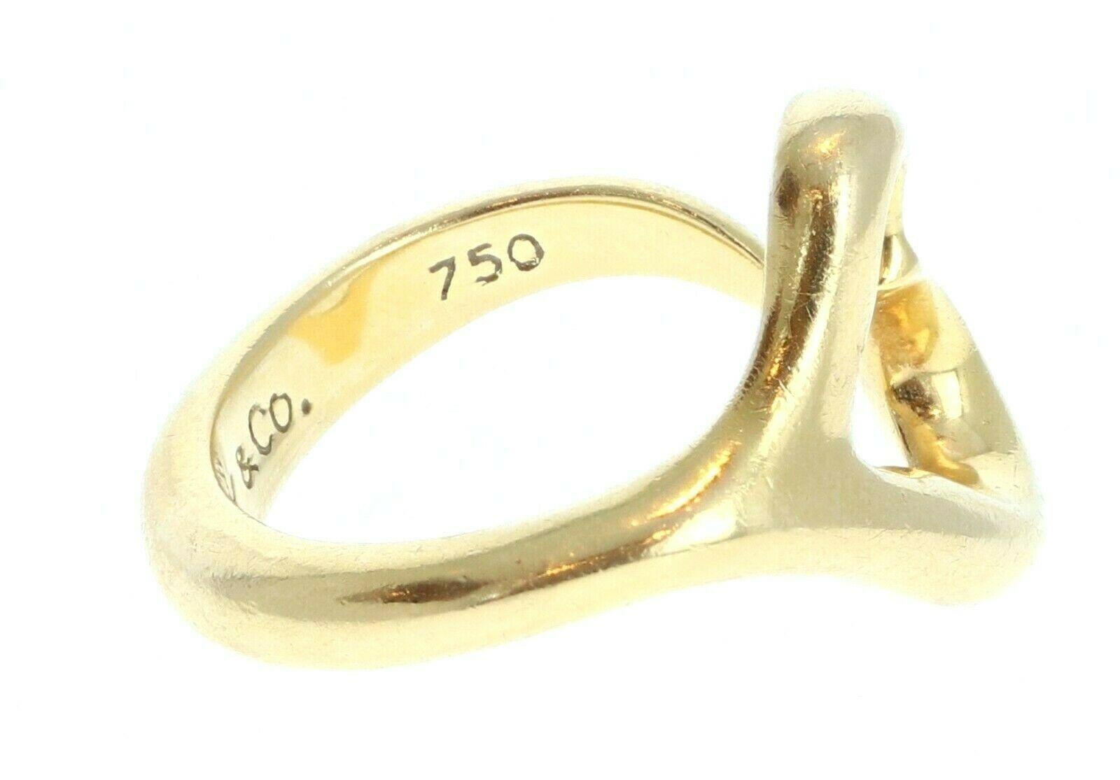 Tiffany & Co. Elsa Peretti 18K Yellow Gold Open Heart Wrap Ring Size 6

For sale is a Tiffany & Co Elsa Peretti 18k yellow gold open heart ring . 
 Perfect worn day or night.
 Get this stunning ring now!



Metal: PLATINUM
     
Hallmark: Tiffany &