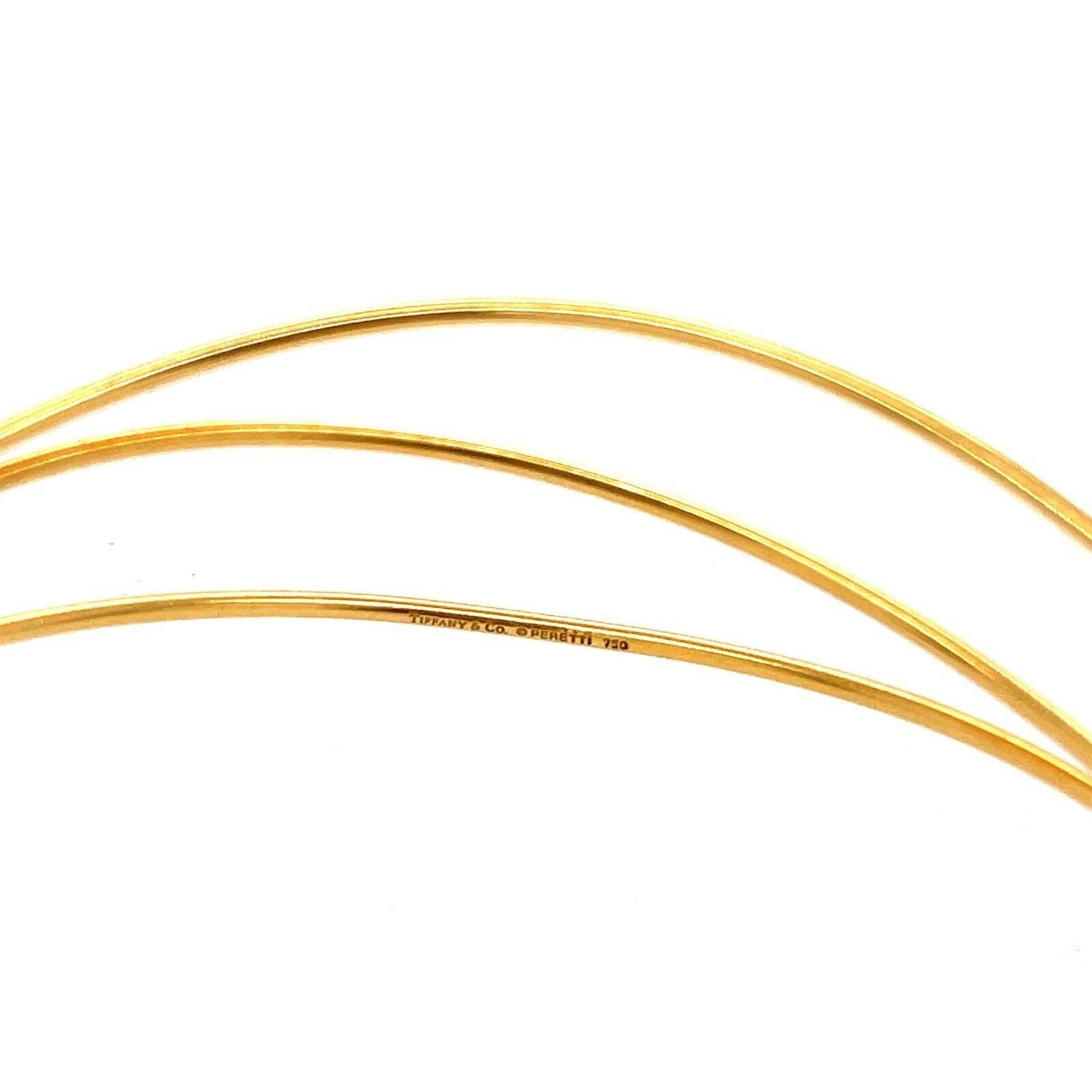 Tiffany & Co. Elsa Peretti 18k Yellow Gold Three Wave Bangle Bracelet



Here is your chance to purchase a beautiful and highly collectible designer bangle  Truly a great piece at a great price! 



Weight: 11.2 grams



Condition: