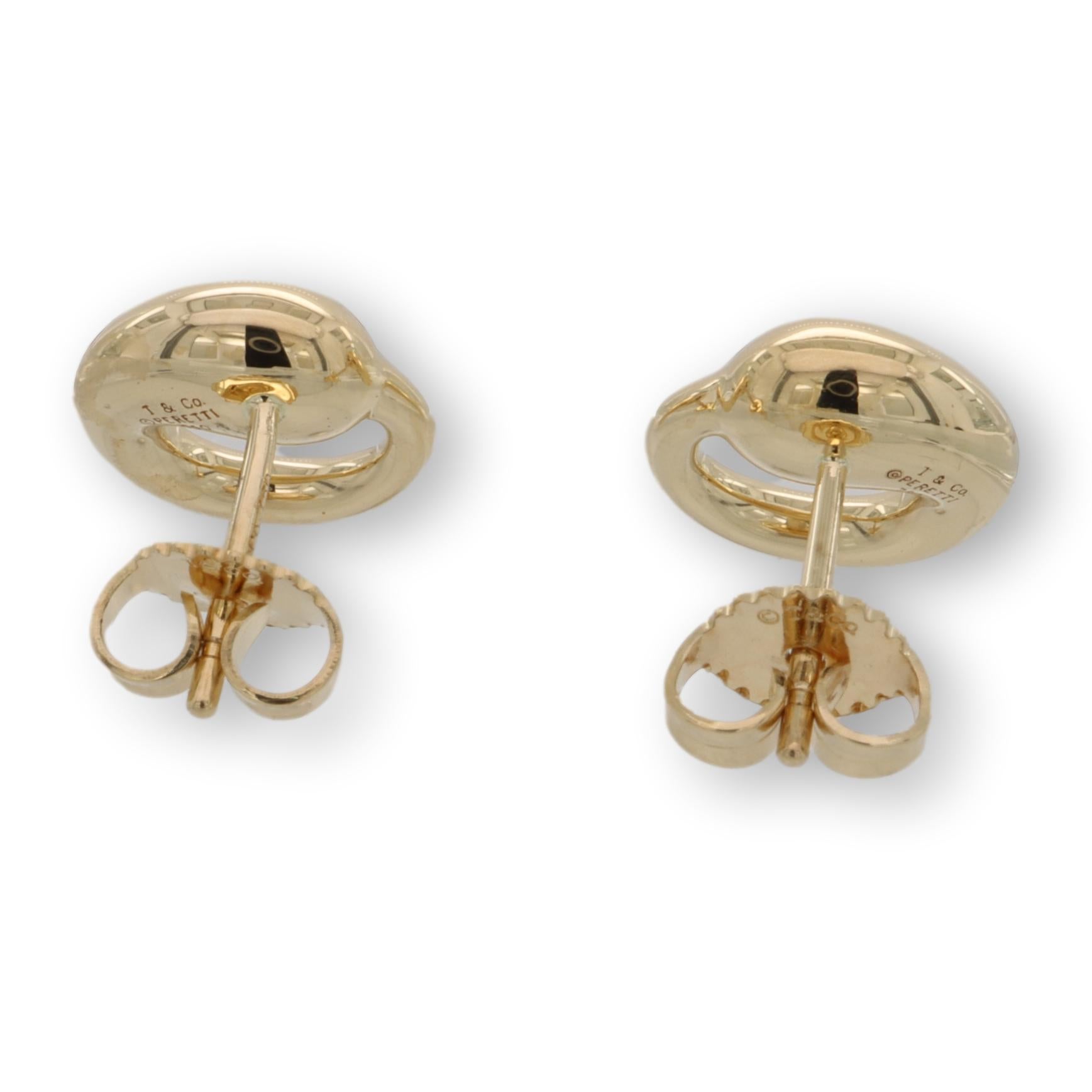 Vintage Tiffany & Co. stud earrings designed by Elsa Peretti from the eternal circle collection finely crafted in 18 karat yellow gold with posts and butterfly small backs. Fully hallmarked with designer logos and metal content. This is a