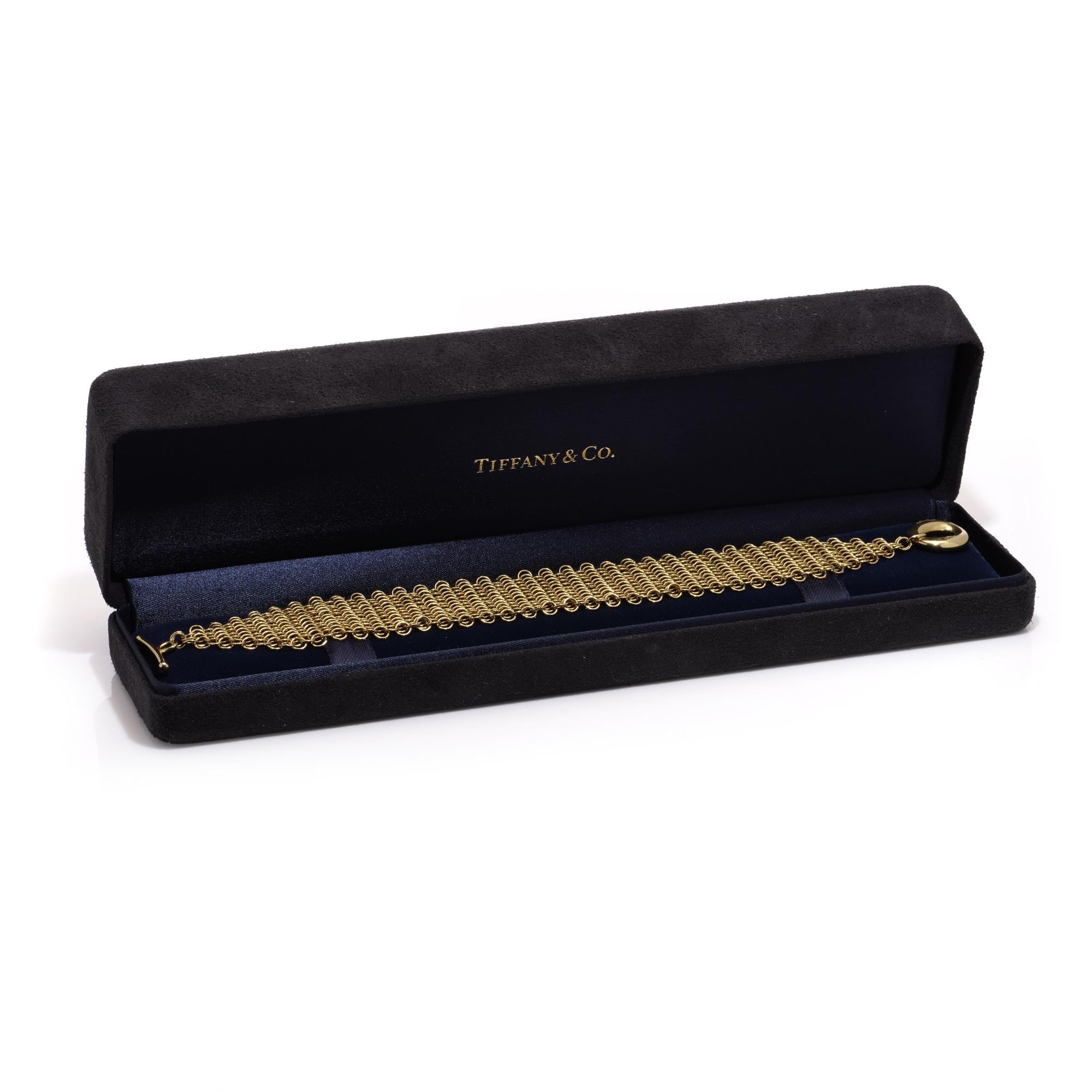 Tiffany & Co. 18kt. yellow gold multi-strand mesh bracelet designed by Elsa Peretti.
Made in 1990s.
The clasp of the bracelet bears the marks 