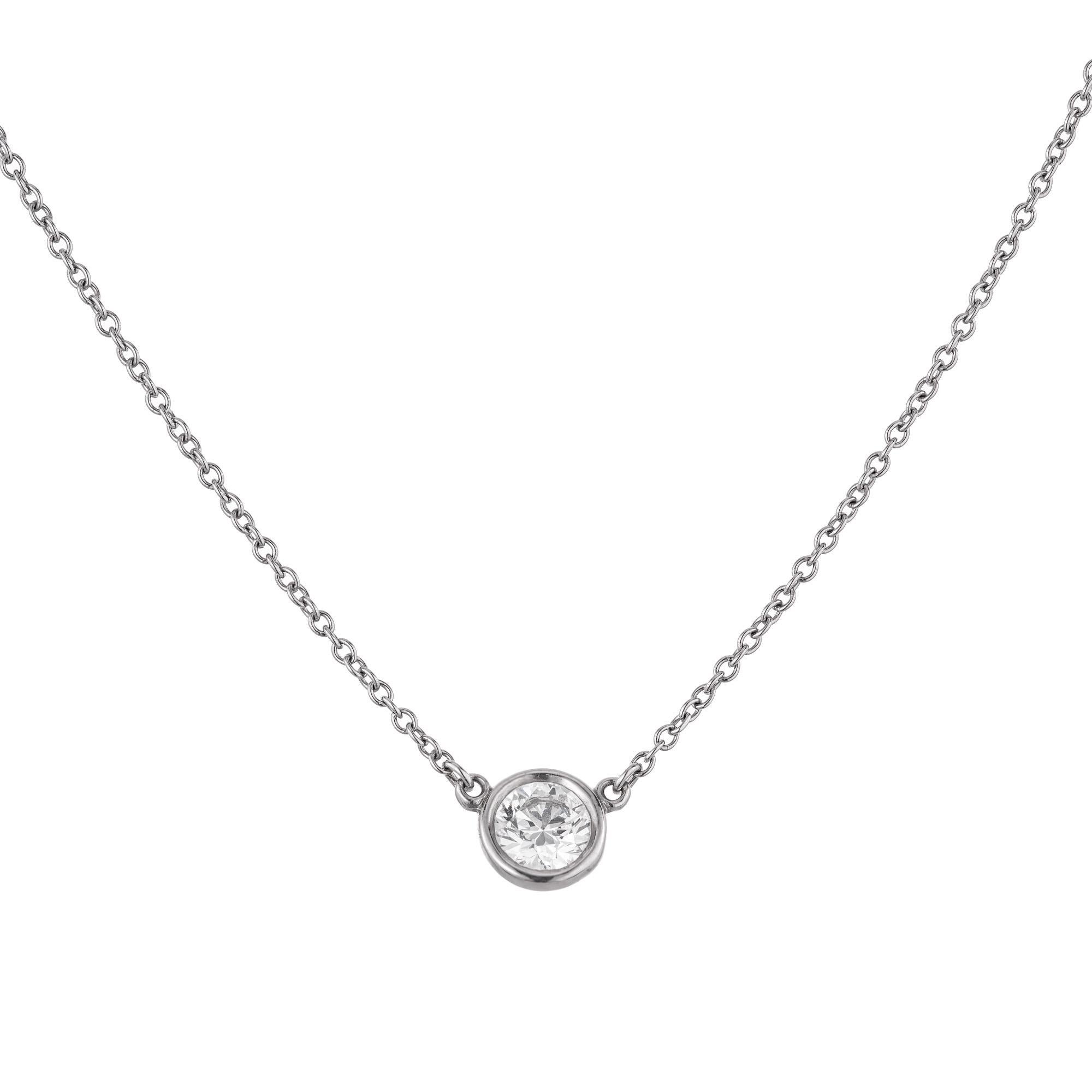 The Tiffany & Co. Elsa Peretti .37ct diamond platinum pendant necklace is a dazzling ode to timeless elegance. Crafted with precision, the 18 inch platinum chain gracefully suspends a radiant bezel set .37ct round brilliant cut diamond, capturing