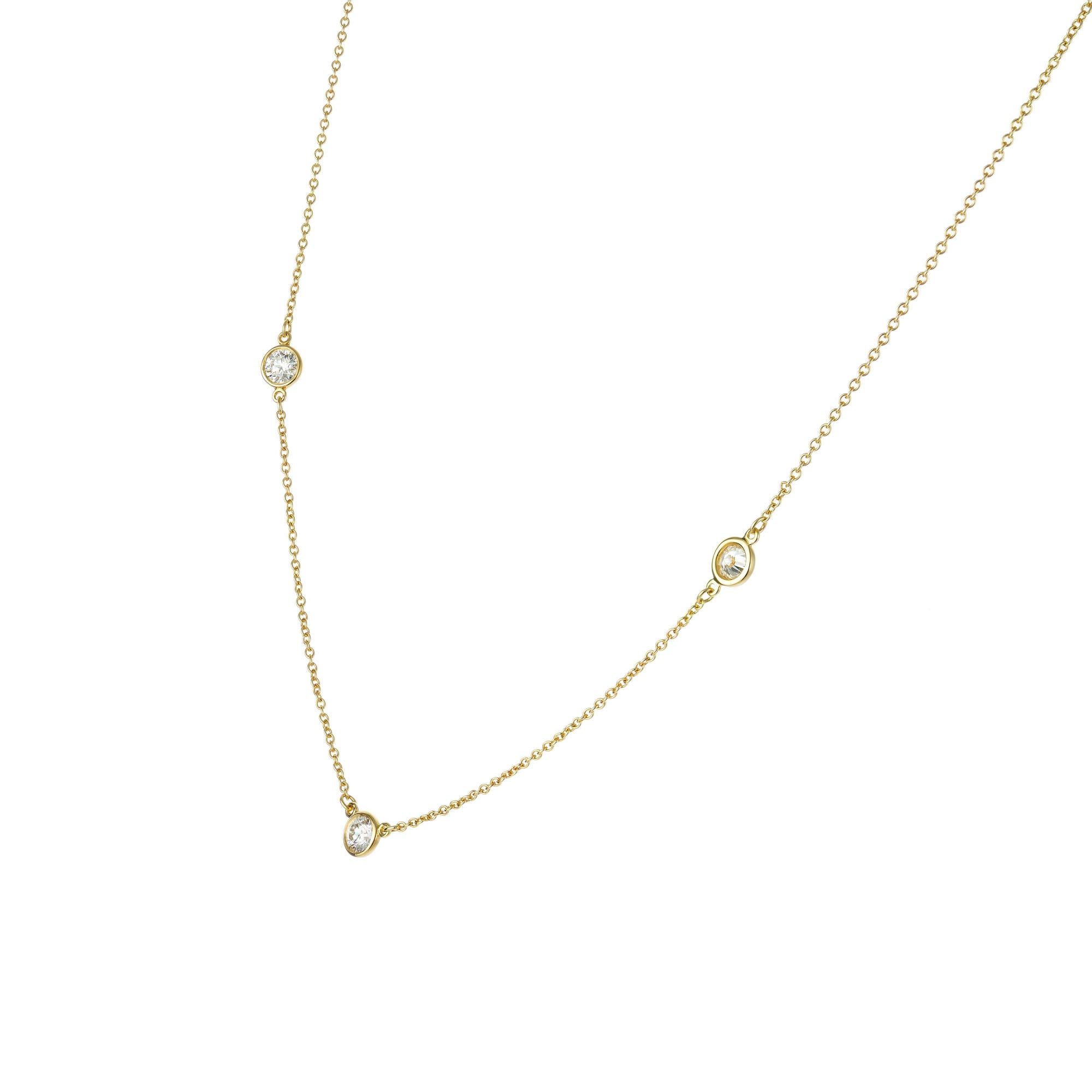 Tiffany & Co Elsa Peretti three diamond by the yard style necklace with fine white full cut diamonds. 16.5 inches long. 

3 Ideal round brilliant cut diamonds, .23ct each, approx. total weight .69cts, F-G, VS
18k Yellow gold
Stamped: 750
Hallmark: