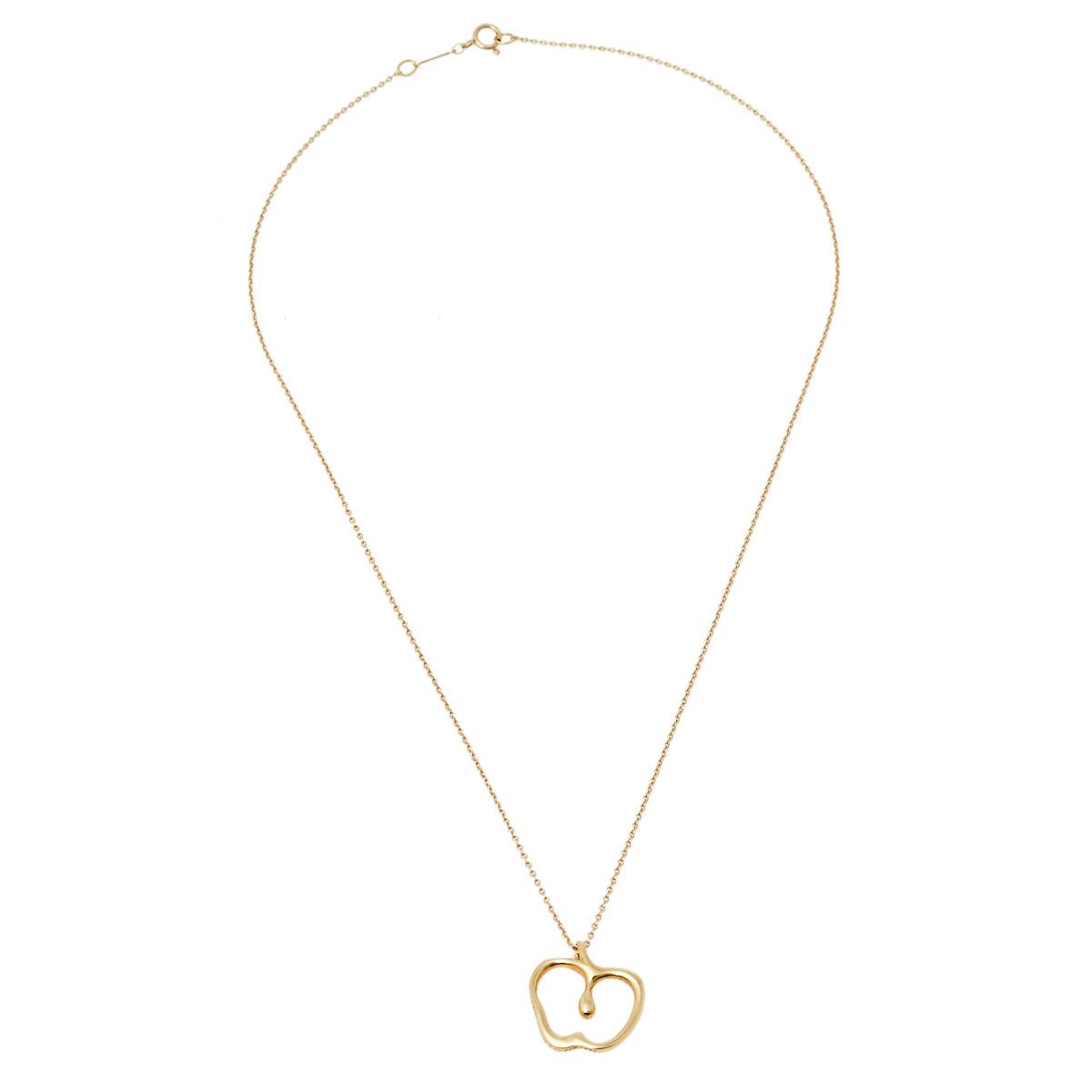 Tiffany & Co. presents this stunning necklace that will brighten up your look every day. It features an 18k yellow gold pendant designed to resemble an apple. This Elsa Peretti creation is a perfect buy for a collector. The pendant is secured with a