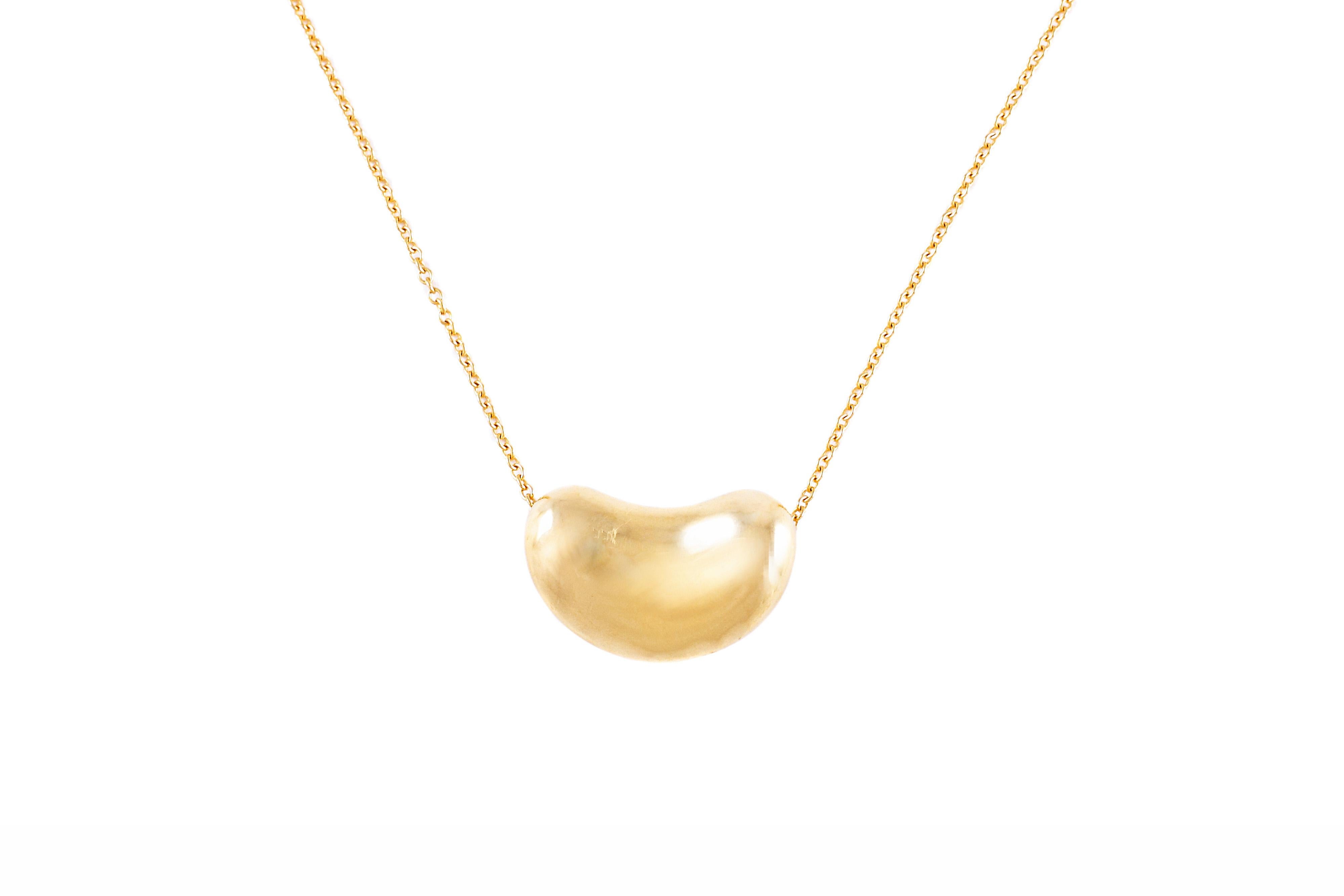18 karat yellow gold Bean necklace designed by Elsa Peretti for Tiffany & Co.  The bean is 18 millimeters wide and is on a 16 inch chain.