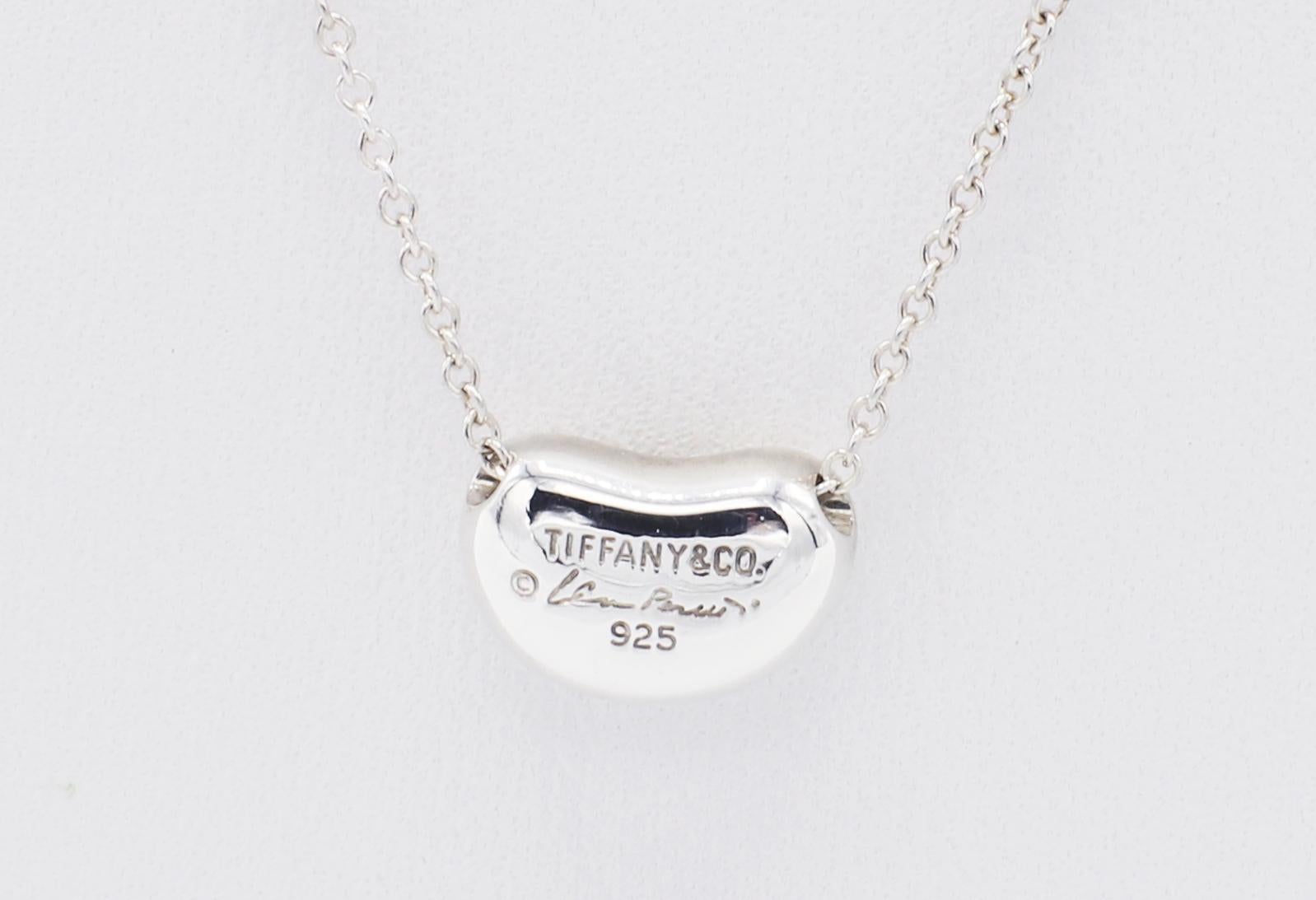 Tiffany & Co. Elsa Peretti Bean Sterling Silver Pendant Necklace 
Metal: Sterling silver, 925
Weight: 3.25 grams
Bean: 10.8 x 7MM
Chain length: 19 inches 
Signed: 