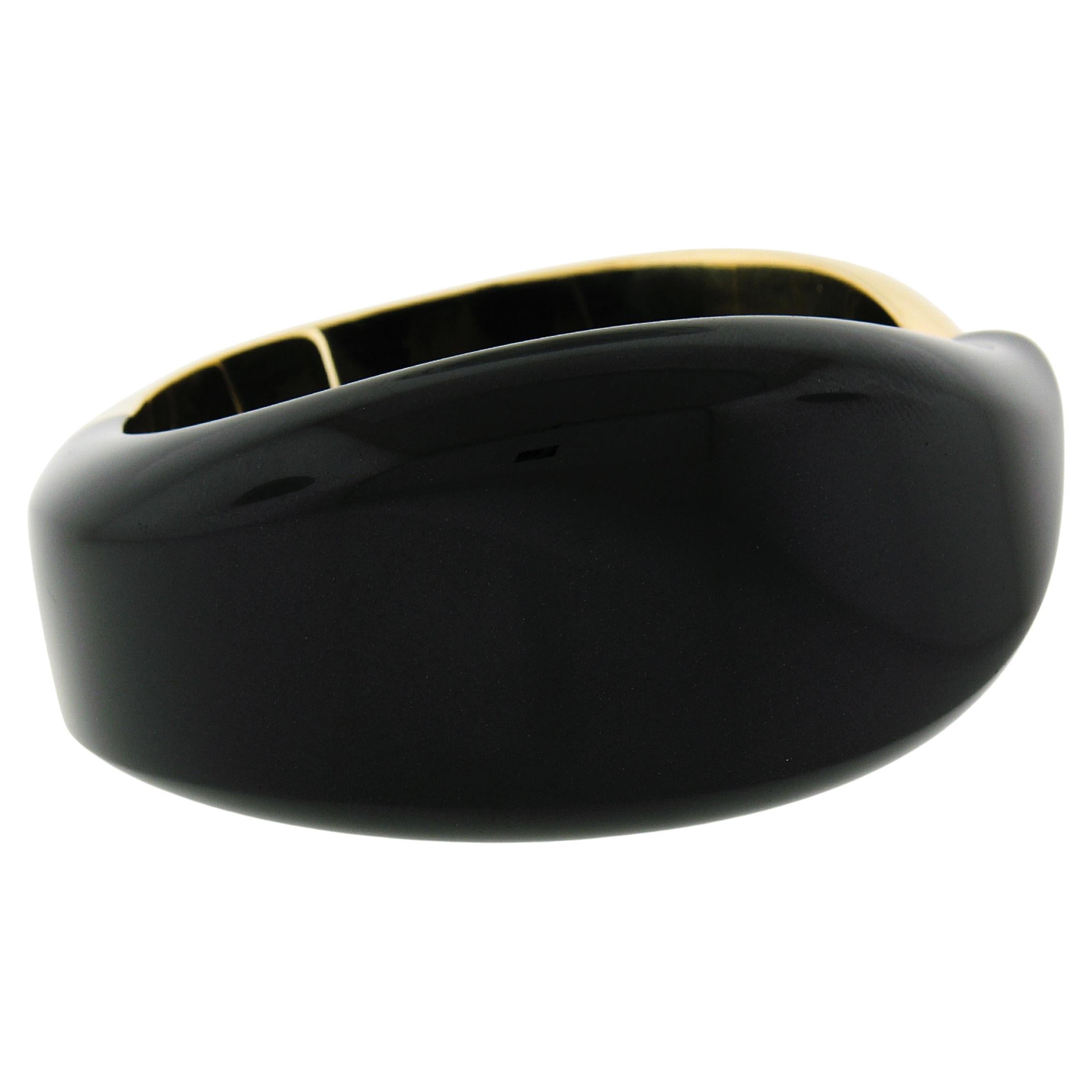 Material: 18k Yellow Gold & Black Jade
Weight: 107.14 Grams
Bracelet Type: Hinged Bangle Cuff Bracelet
Length: Will fit up to a 6.7 inch wrist
Width: 30mm (1.19 in) 
Thickness: 8.1mm rise off the wrist
Signature(s): Tiffany & Co. ©Elsa Peretti 750