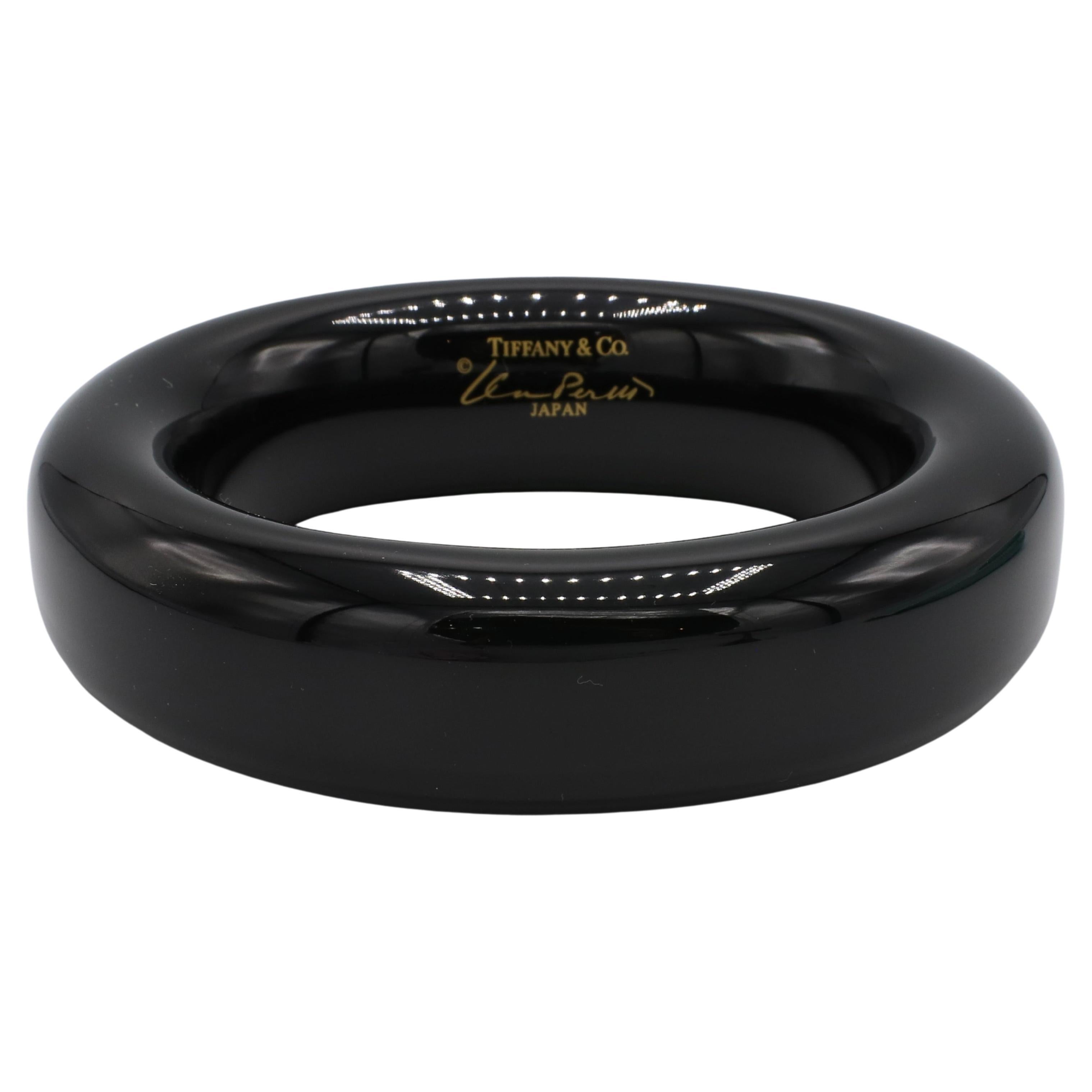 Tiffany & Co. Elsa Peretti Black Lacquer Bangle Bracelet
Material: Black lacquer over Japanese hardwood
Weight: 40.7 grams
Width: 23mm
Inner Circumference: 7.5 inches
Signed: Tiffany & Co. ©Elsa Peretti JAPAN
Retail: $725 USD
