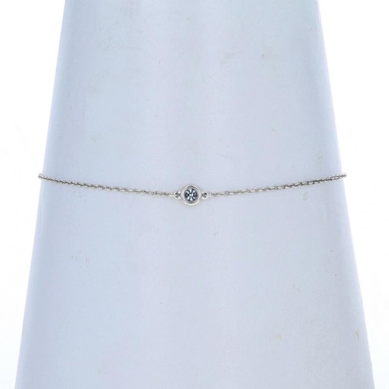 Retail Price: $410

Brand: Tiffany & Co.
Designer: Elsa Peretti
Design:  Color by the Yard

Metal Content: Sterling Silver

Stone Information

Natural Aquamarine
Treatment: Heating
Carat(s): .06ct
Cut: Round
Color: Light Blue

Style: Station
Chain
