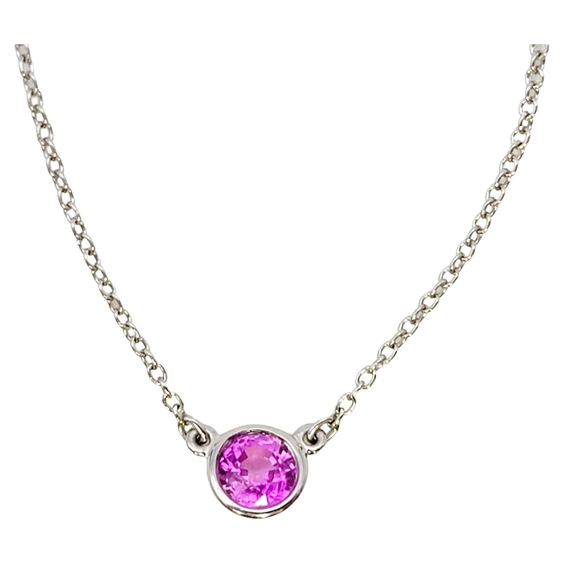 This dainty 'Color by the Yard' sapphire pendant necklace from Tiffany & Co. is the epitome of understated elegance. Featuring a delicate cable chain and single bezel set solitaire natural round pink sapphire, this piece goes with just about