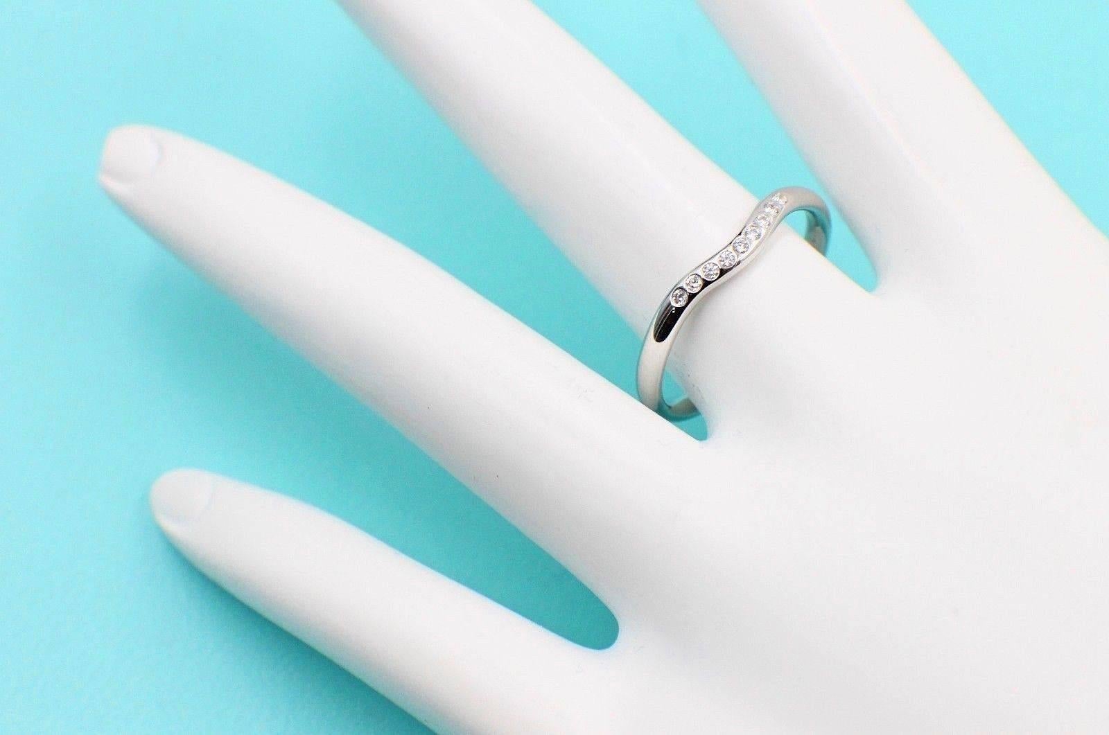 Tiffany & Co.
Style:  Elsa Peretti Wedding Band Ring
Serial Number:  15636939
Metal:  Platinum PT950
Size:  8.25 - sizable
Total Carat Weight:  0.06 TCW
Diamond Shape:  Round Brilliant Diamonds
Diamond Color & Clarity:  F / VVS
Hallmark: 