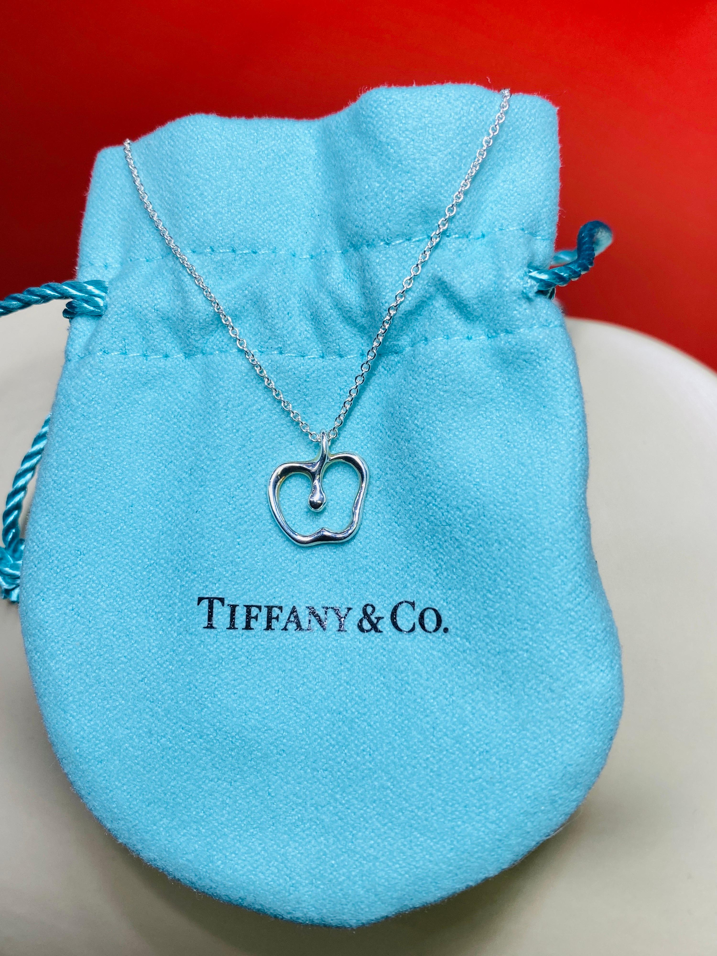 Tiffany & Co 925 sterling silver apple pendant and 16” chain designed by Else Peretti. 1.4Dwt
