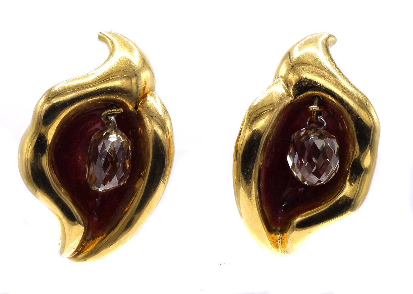 Beautifully designed by Elsa Peretti and masterfully handcrafted by Tiffany & Co these one of a kind ear clips are a true work of art on the ear. Crafted in 18 karat yellow gold in the abstract form of a flower embellished on the interior with