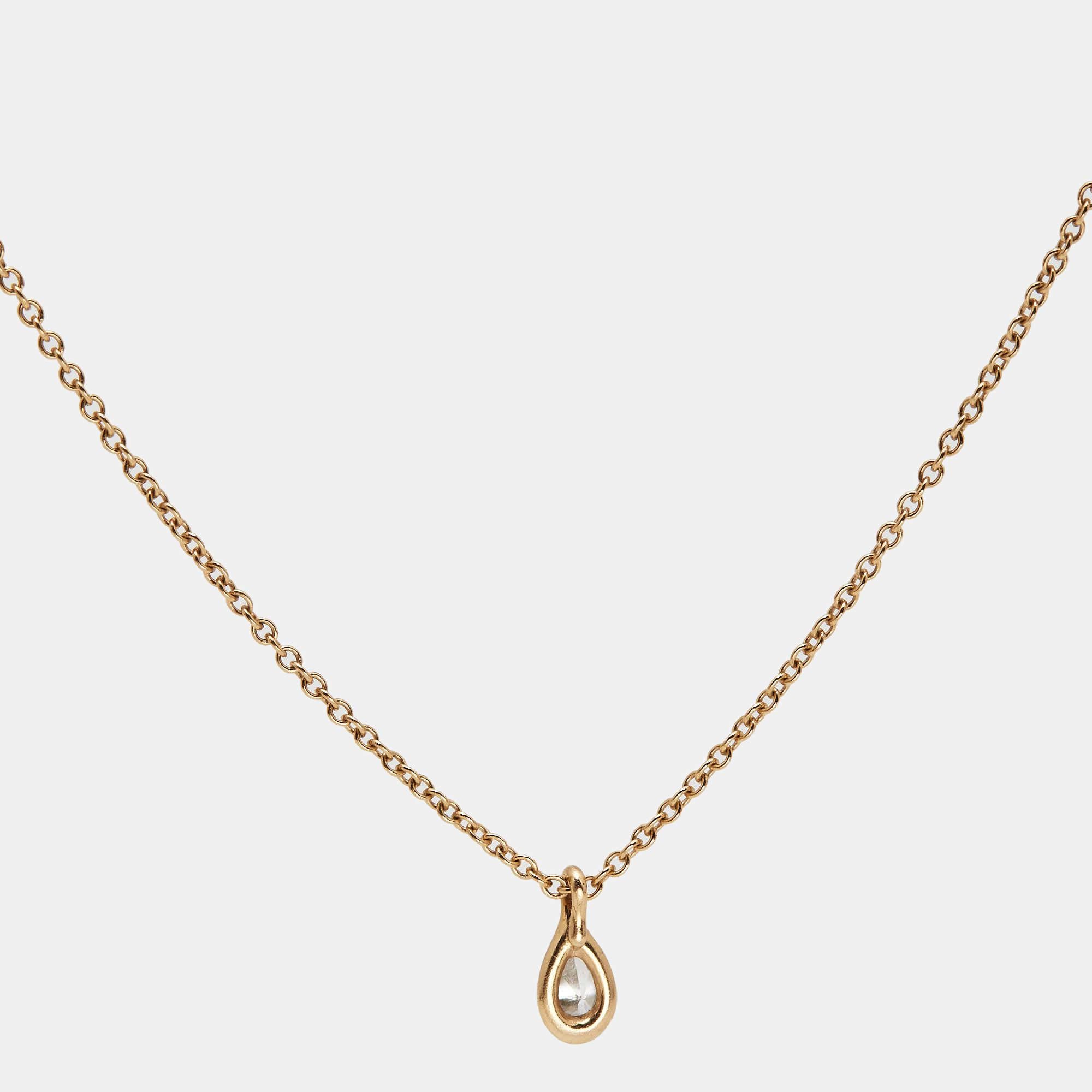 This gorgeous Tiffany & Co. Elsa Peretti By The Yard necklace is uniquely elegant and chic. Designed in 18K rose gold, this alluring piece features a pear-shaped diamond pendant. Singular and contemporary, this piece will add subtle glamour to your