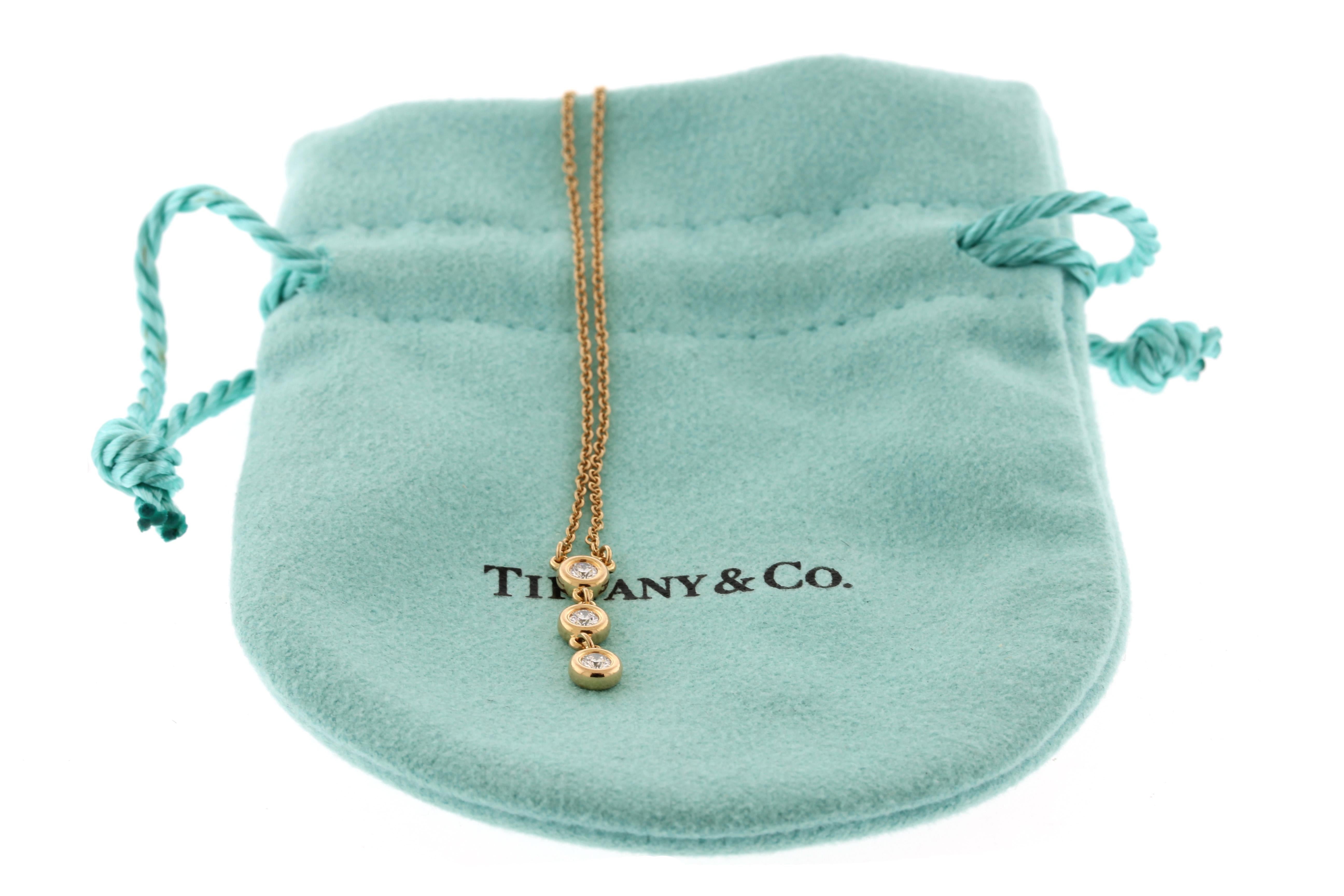 This necklace was designed by Elsa Peretti for Tiffany & Co. In 18kt rose gold, this diamond by the yard drop pendant necklace has 3 diamonds for a total carat weight of .21cts. Made in Spain 

-Designer: Elsa Peretti for Tiffany & Co.
-Metal: 18kt