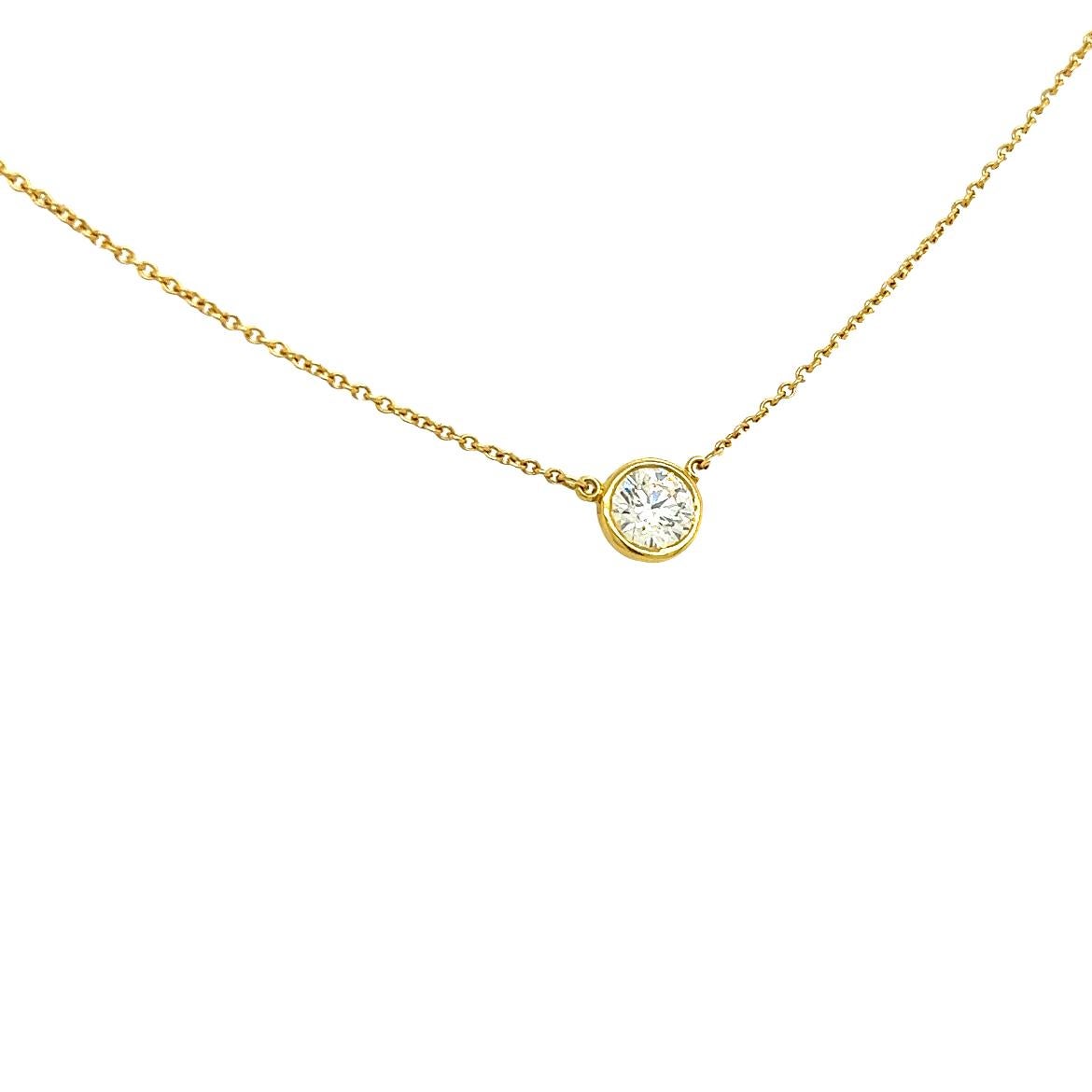A single hand-polished diamond shines at the center of this delicate and refined 18k yellow gold pendant. Elsa Peretti’s revolutionary Diamonds by the Yard collection features a combination of fine, fluid chains and bezel-set stones that forever
