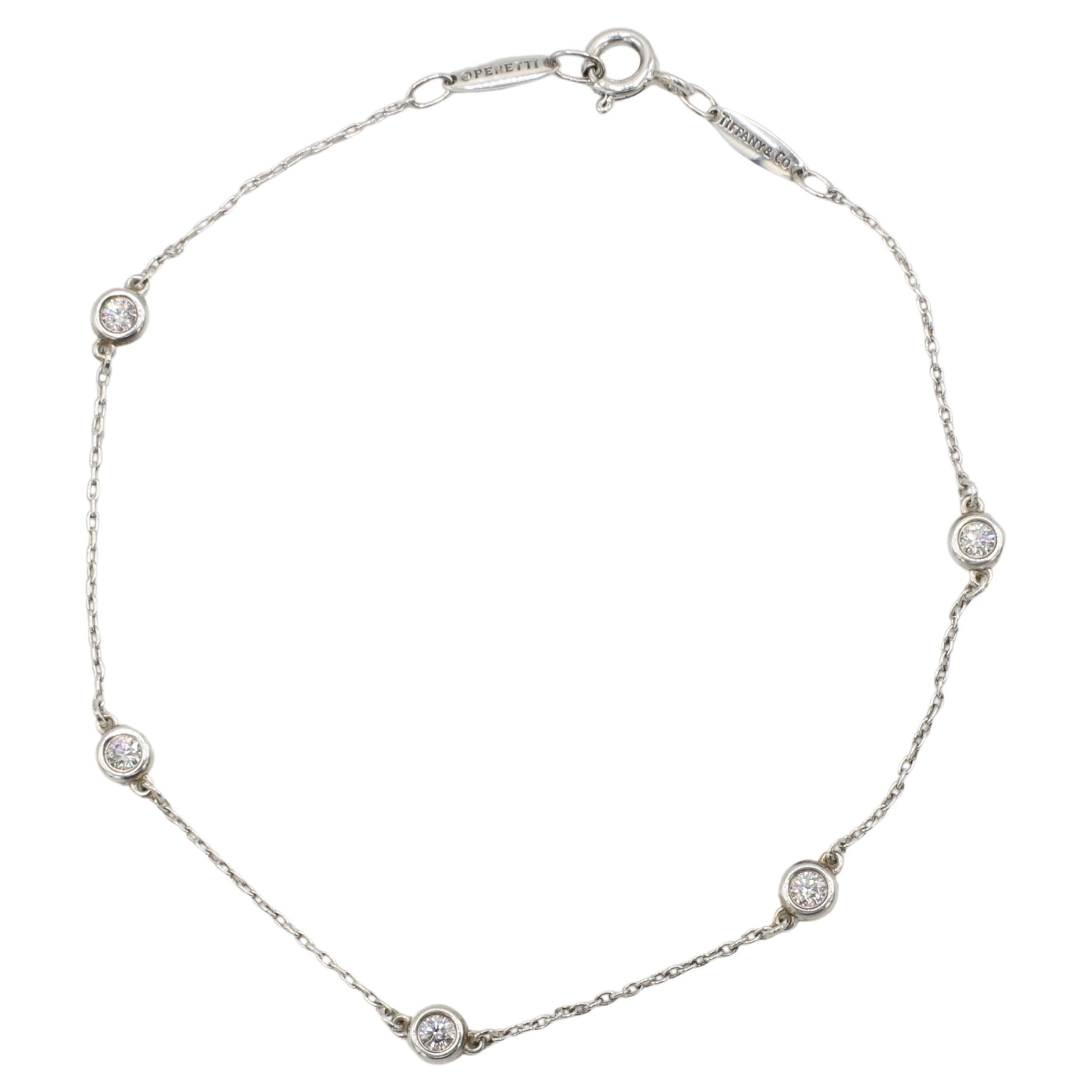 Tiffany & Co. Elsa Peretti Diamond By The Yard Sterling Silver Station Bracelet
Metal: Sterling silver 925
Weight: 1.70 grams
Diamonds: 0.25 CTW round natural diamonds F-G VS
Length: 7 inches
Retail: $2,600 USD
Signed: Tiffany & Co. ©PERETTI Spain