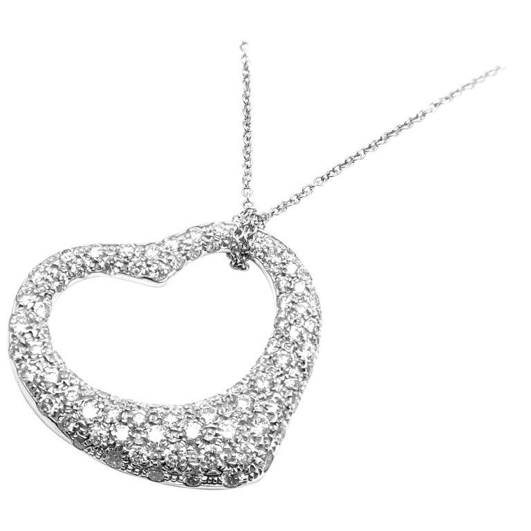 Platinum Diamond Large Open Heart Pendant Necklace by Elsa Peretti for Tiffany & Co.
With Diamonds VS1 clarity, G color total weight approx. 3.00ct
Details:
Length: 16.5