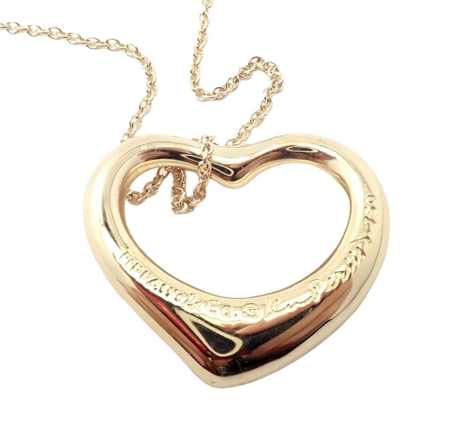 18k Yellow Gold Diamond Open Heart Pendant Necklace by Elsa Peretti for Tiffany & Co.
With Round brilliant cut diamonds VS1 clarity, G color total weight approx. .90ct
Details:
Length: 18