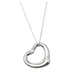 Tiffany
Co. Elsa Peretti Diamond Sterling Silver Open Heart Pendant Tiffany
Co. Elsa Peretti Diamond Sterling Silver Open Heart Pendant