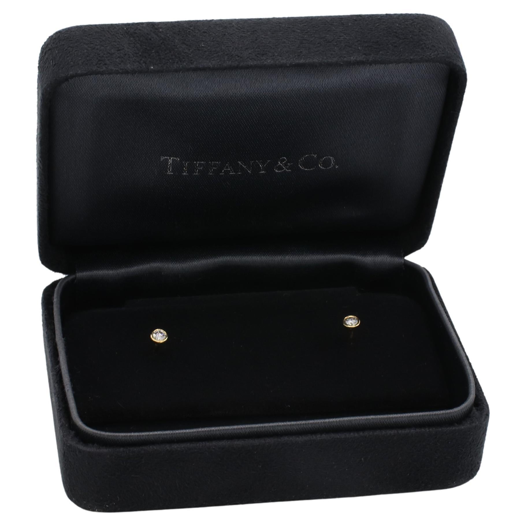 Tiffany & Co. Elsa Peretti Diamonds By The Yard .16 Carat Gold Stud Earrings 
Metal: 18k yellow gold
Weight: 0.77 grams
Diamonds: .16 CTW E-F VVS natural round diamonds
Diameter: 3.5mm
Retail: $1,700 USD
