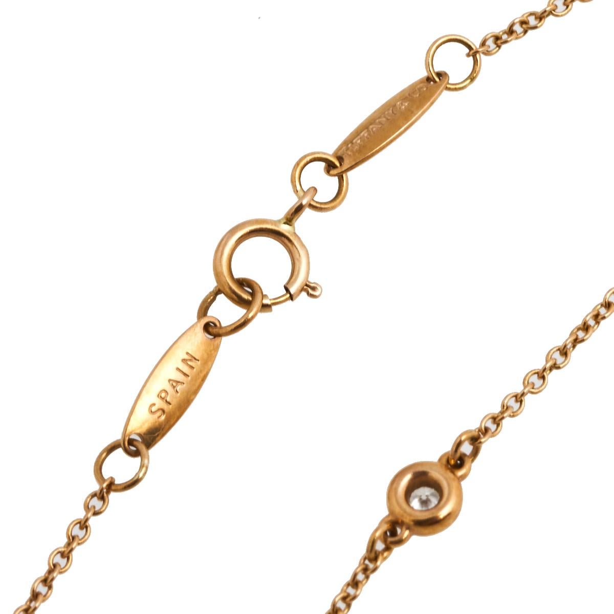 Constructed in beautiful 18k rose gold, this Tiffany & Co. Elsa Peretti Diamonds by the Yard bracelet will make an elegant and stylish addition to your collection. The delicate chain on this bracelet holds a spring-ring clasp and three single