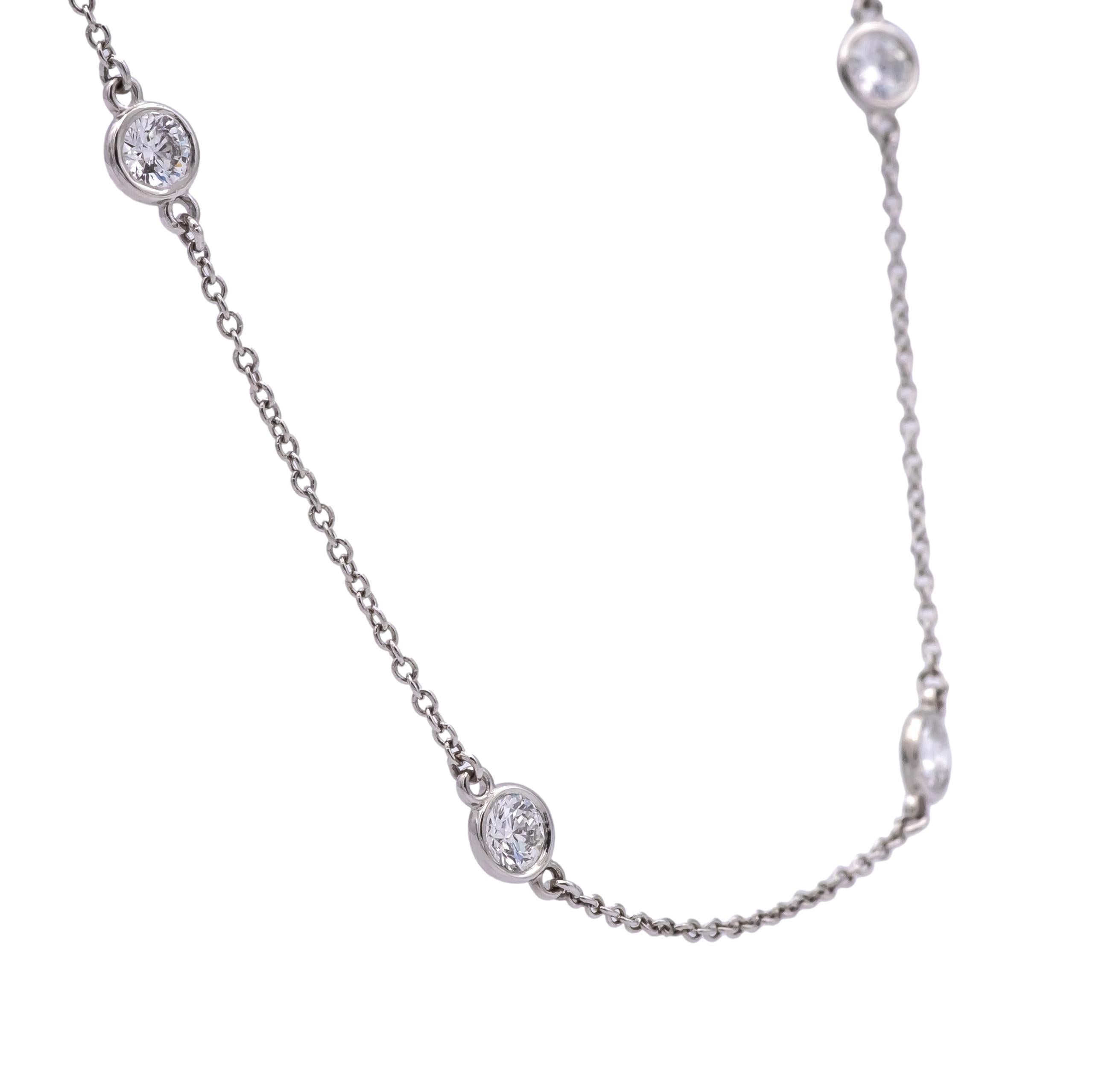 This Tiffany & Co. Elsa Peretti Diamonds by the Yard Necklace, from Dec 2022,  is truly stunning, was barely worn, and in perfect, brand new condition.  This iconic design features 20 bezel set diamonds of exceptional quality , on a platinum chain