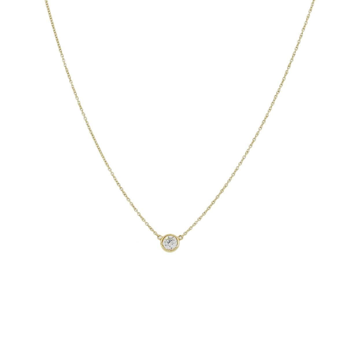 Designer: Tiffany & Co.
Material: 18k yellow gold
Diamond Details: Approximately 0.38ct round brilliant diamond. Diamond is G/H in color and VS in clarity
Pendant Measurements: 0.23″ x 0.11″ x 0.31″
Clasp: Spring ring clasp
Necklace length: Necklace