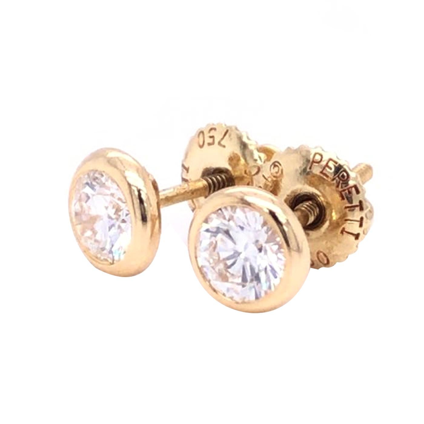 From Elsa Peretti for Tiffany & Co's, a pair of a bezel-set diamond by the yard diamond ear studs, A modern take on classic diamond studs, the simple design of these earrings takes center stage with hand-polished bezel-set diamonds. Elsa Peretti’s