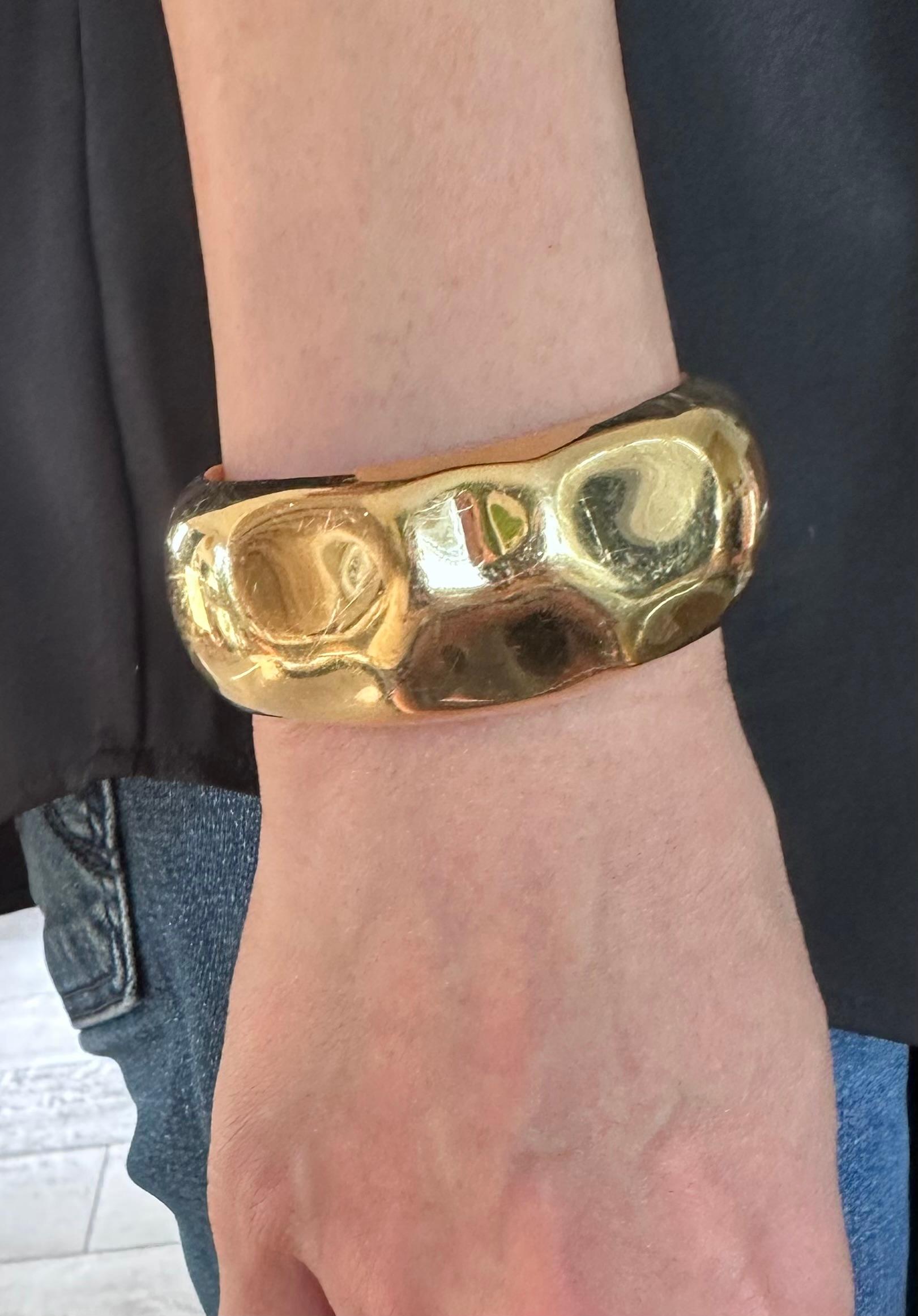 The Tiffany & Co Faceted Cuff Bracelet
This is the Narrow Version. 
Small
5.25 up to 5.75 diameter wrist.
Width: 1.25 Inches 
weight 62 g
18k Yellow Gold 
Retail 16,500

about 
Elsa Peretti, a true pioneer of design, translates all she sees in the