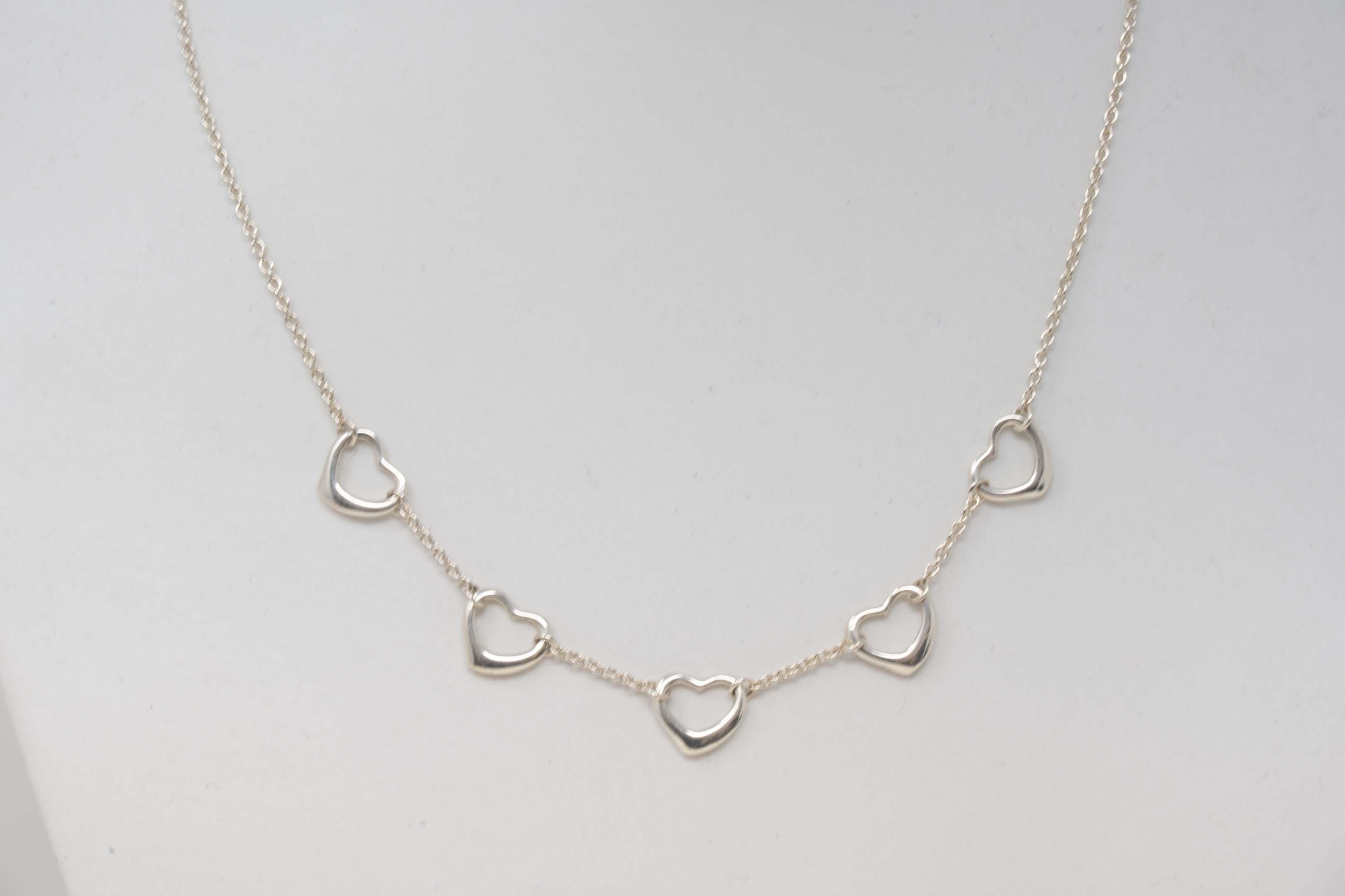 Tiffany & Co Elsa Peretti five open heart pendant necklace. Measures 15 3/4 inches long, stamped Tiffany & Co, Peretti 925 Spain. In good condition, made in Spain.