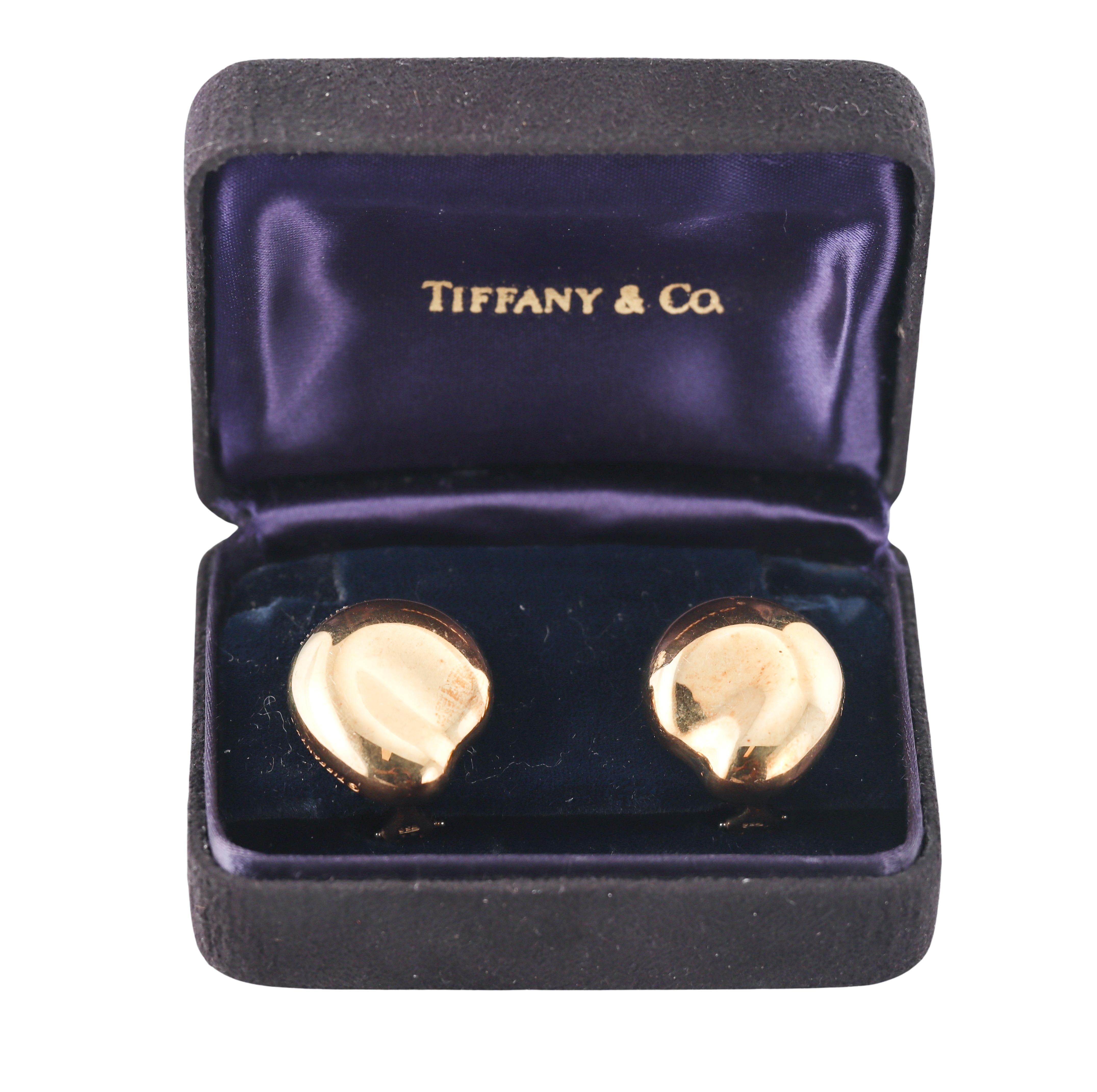 Pair of 18k yellow gold large bean earrings, designed by Elsa Peretti for Tiffany & Co. The earrings measure 26mm x 24mm. With posts for pierced ears. Come in T & Co box. Marked on the side:  Tiffany & Co, Peretti, 18k. Weight - 25.2 grams. 