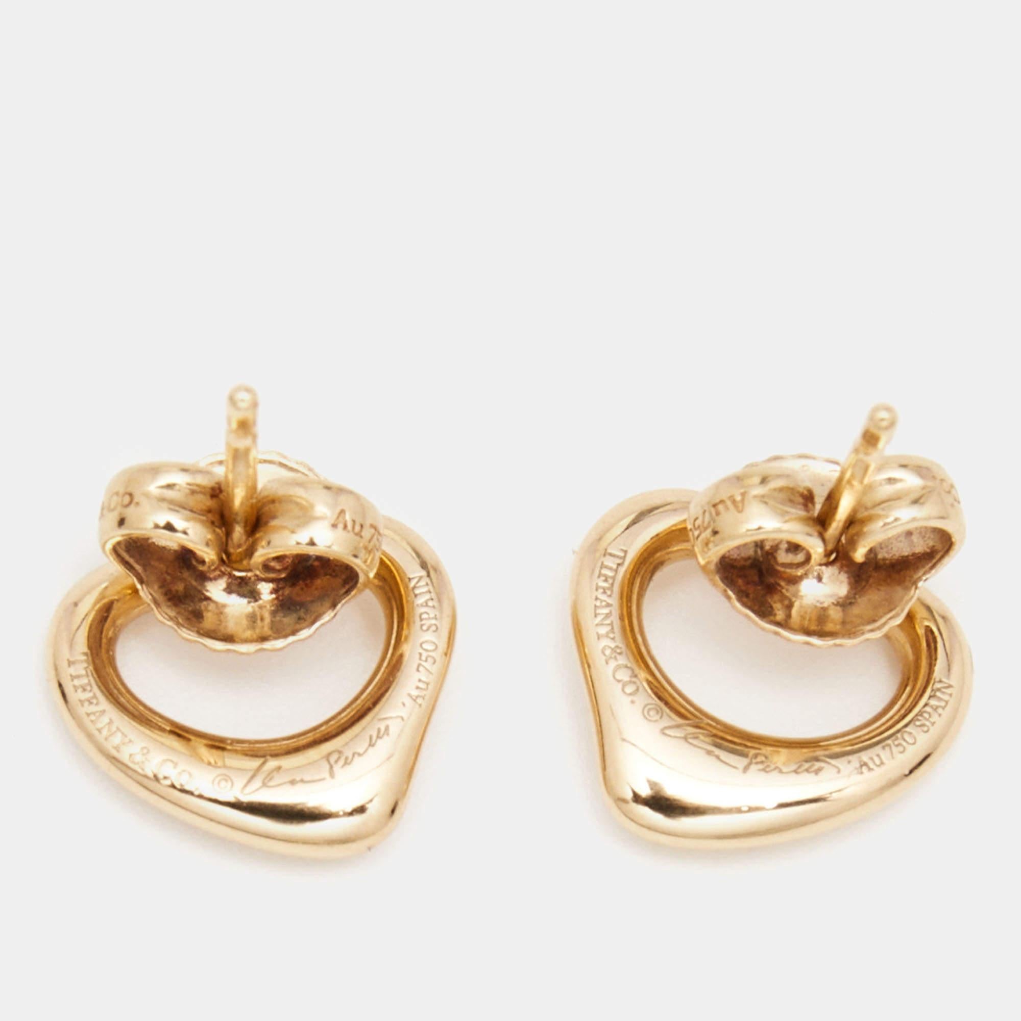 Designed with 18k rose gold, these Elsa Peretti Open Heart earrings from Tiffany & Co. will complement a day or evening look. Balance your outfits with this elegant pair.

Includes: Original Case
