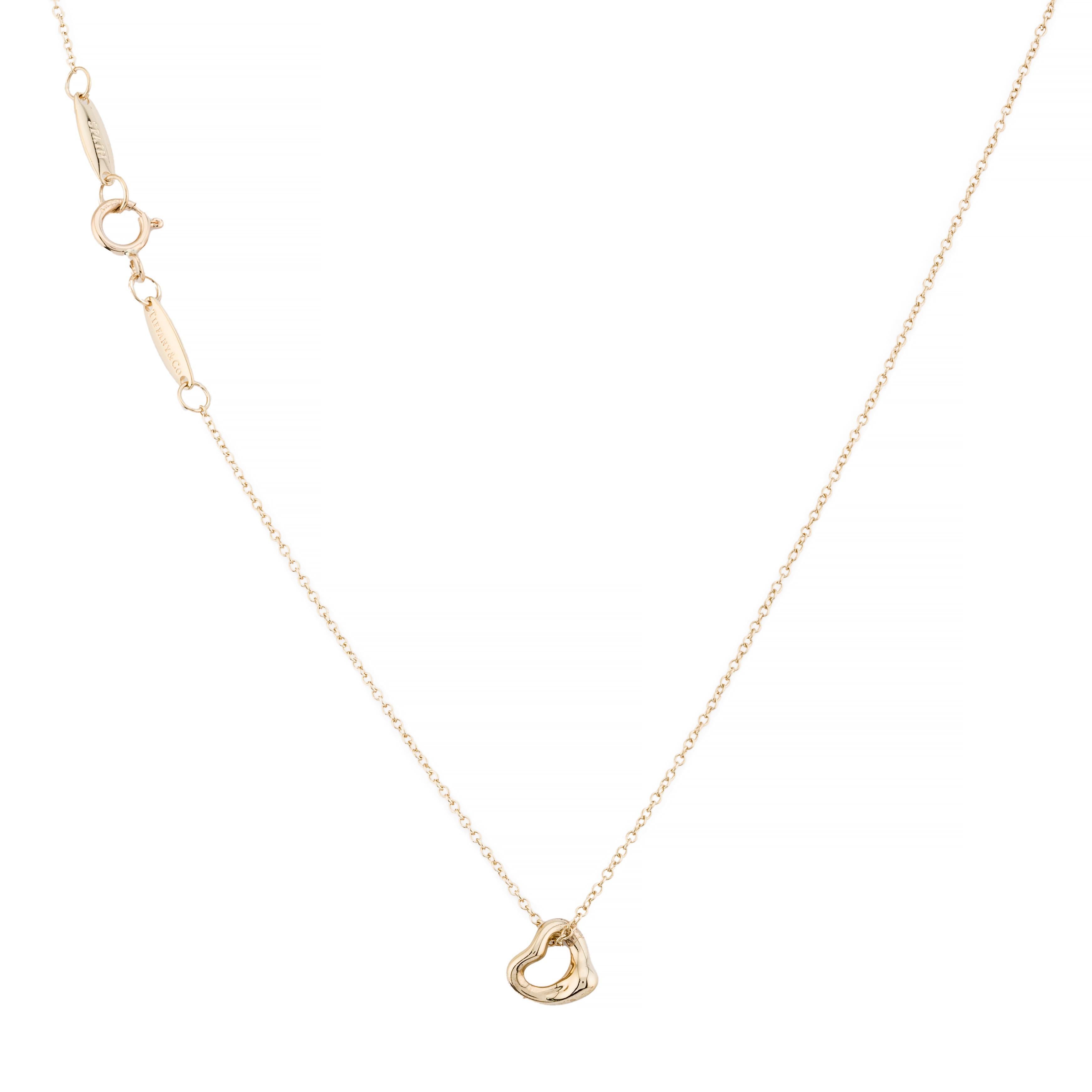 Aston Estate Jewelry Presents:

A captivating Tiffany & Co by Elsa Peretti pendant necklace in 18k yellow gold. Featuring a fluid, abstract heart-shaped design. The pendant is crafted with smooth, polished surfaces, creating a modern and elegant