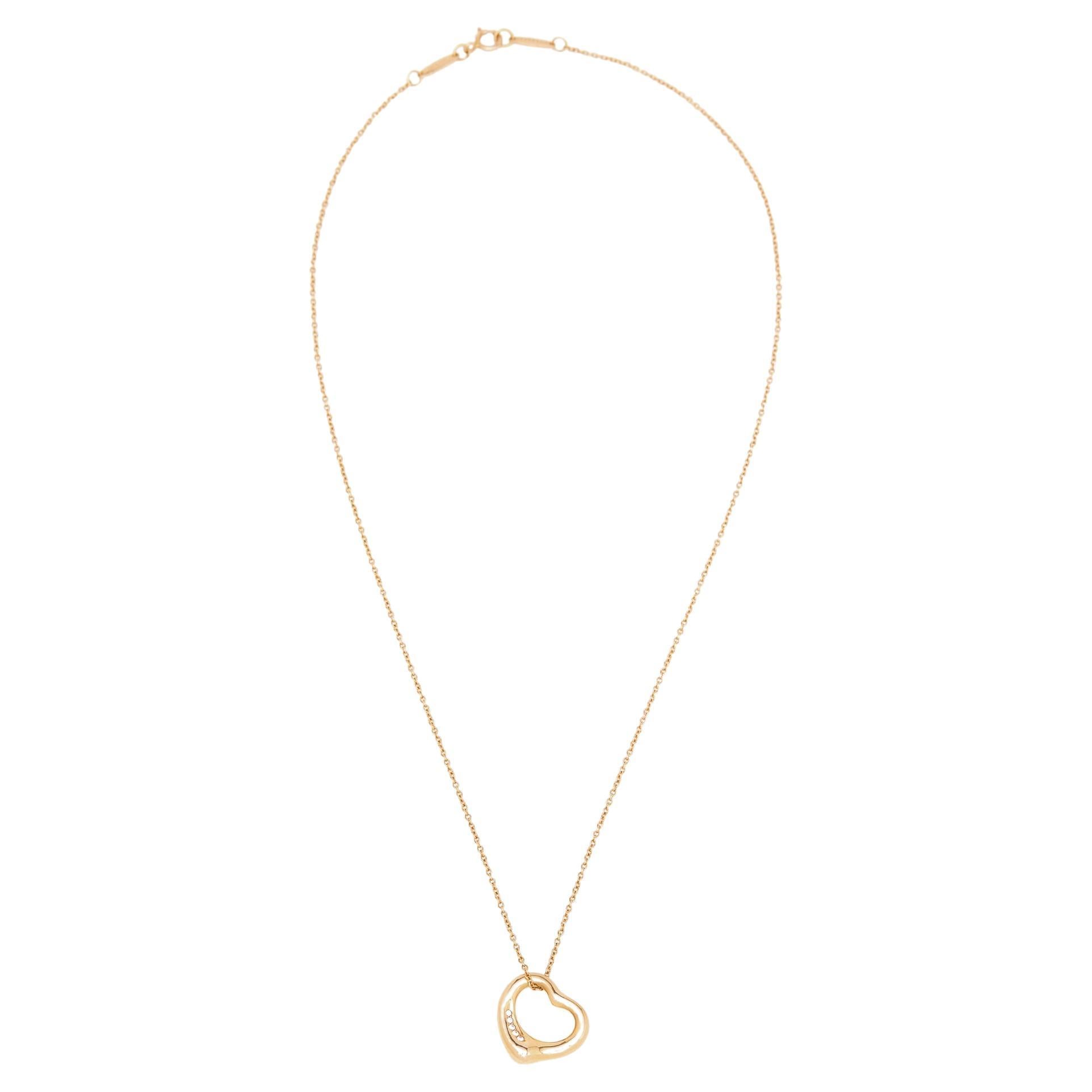 Immerse in the spirit of eternal love with this charming Tiffany & Co. Elsa Peretti Open Heart necklace. Featuring a heart motif and 5 diamonds, this alluring and evocative 18K rose gold necklace is designed to be an everyday