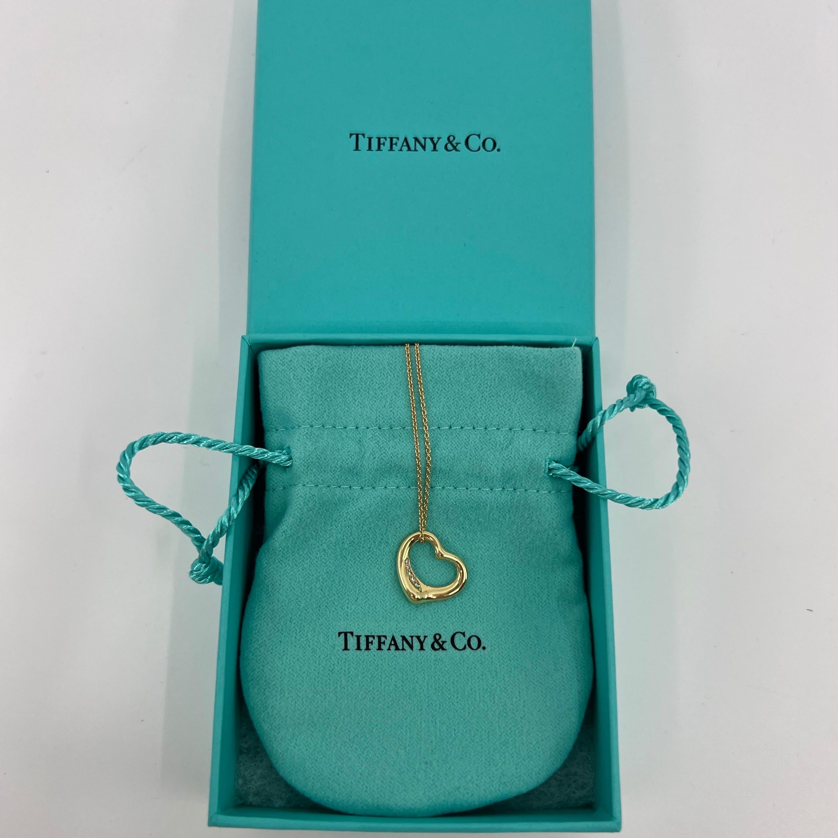 Tiffany & Co. Elsa Peretti Open Heart Diamond 18k Gelbgold Anhänger Halskette.

Ein schöner und authentischer offener Herzanhänger von Tiffany & Co aus dem stilvollen und beliebten Elsa Peretti Sortiment. 

Der Anhänger und die Kette sind aus