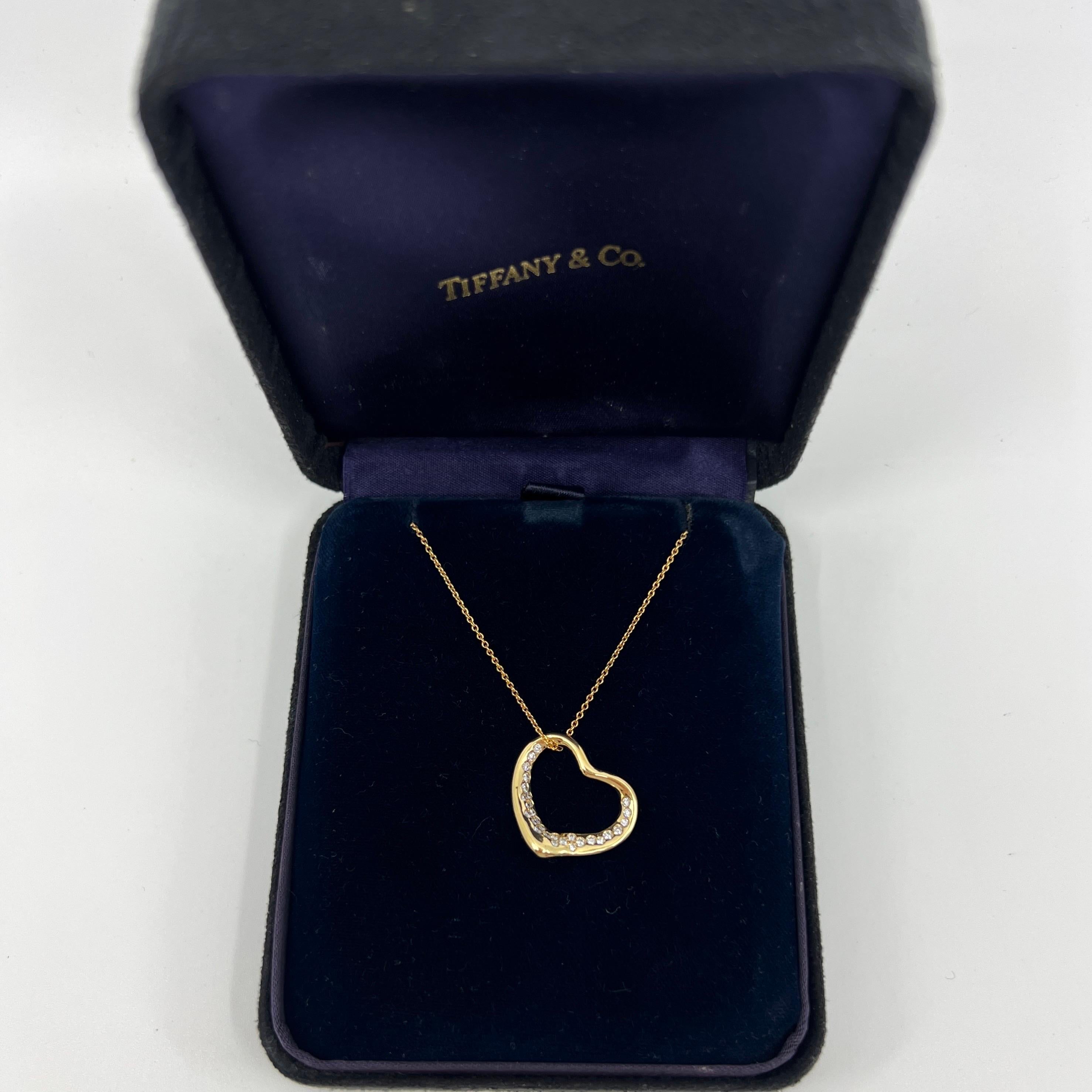 Vintage Tiffany & Co. Collier à pendentif en or jaune 18 carats Elsa Peretti avec un grand cœur ouvert et des diamants.

Un magnifique et rare pendentif authentique de Tiffany & Co en forme de cœur ouvert de la gamme élégante et populaire Elsa