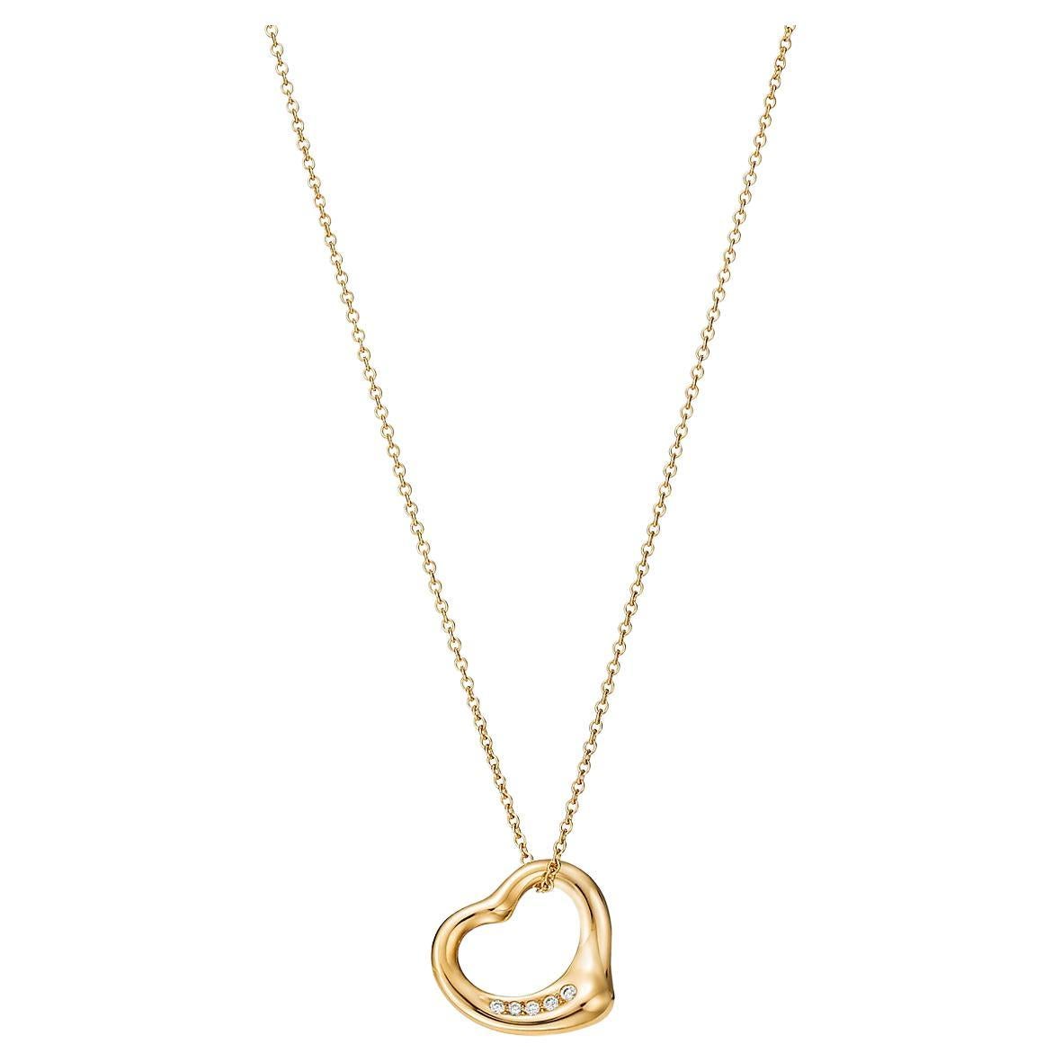 Tiffany 
Co. Elsa Peretti, collier pendentif cœur ouvert en or jaune 18 carats avec diamants