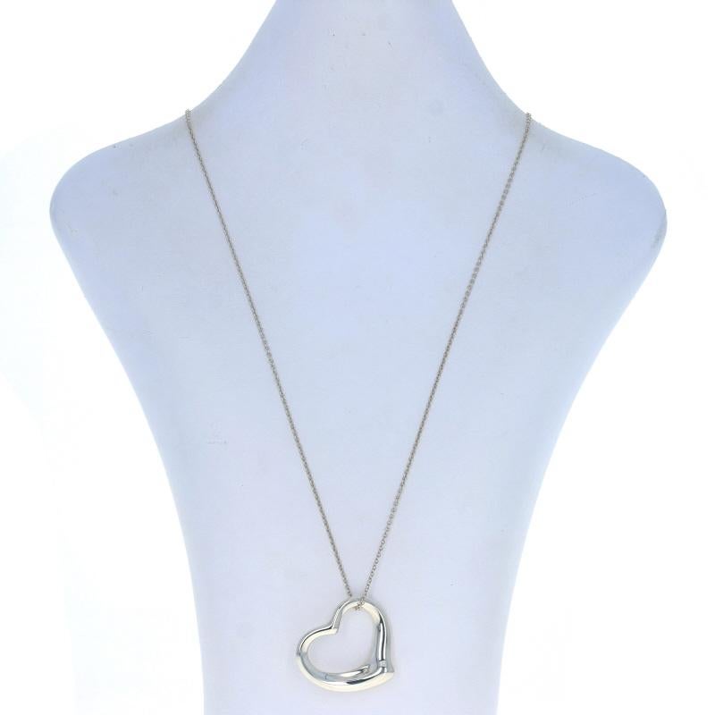 Brand: Tiffany & Co.
Designer: Elsa Peretti
Collection: Open Heart

Metal Content: Sterling Silver

Chain Style: Cable
Fastening Type: Spring Ring Clasp
Theme: Heart, Love

Pendant Measurements
Tall (when suspended diagonally): 1 5/16