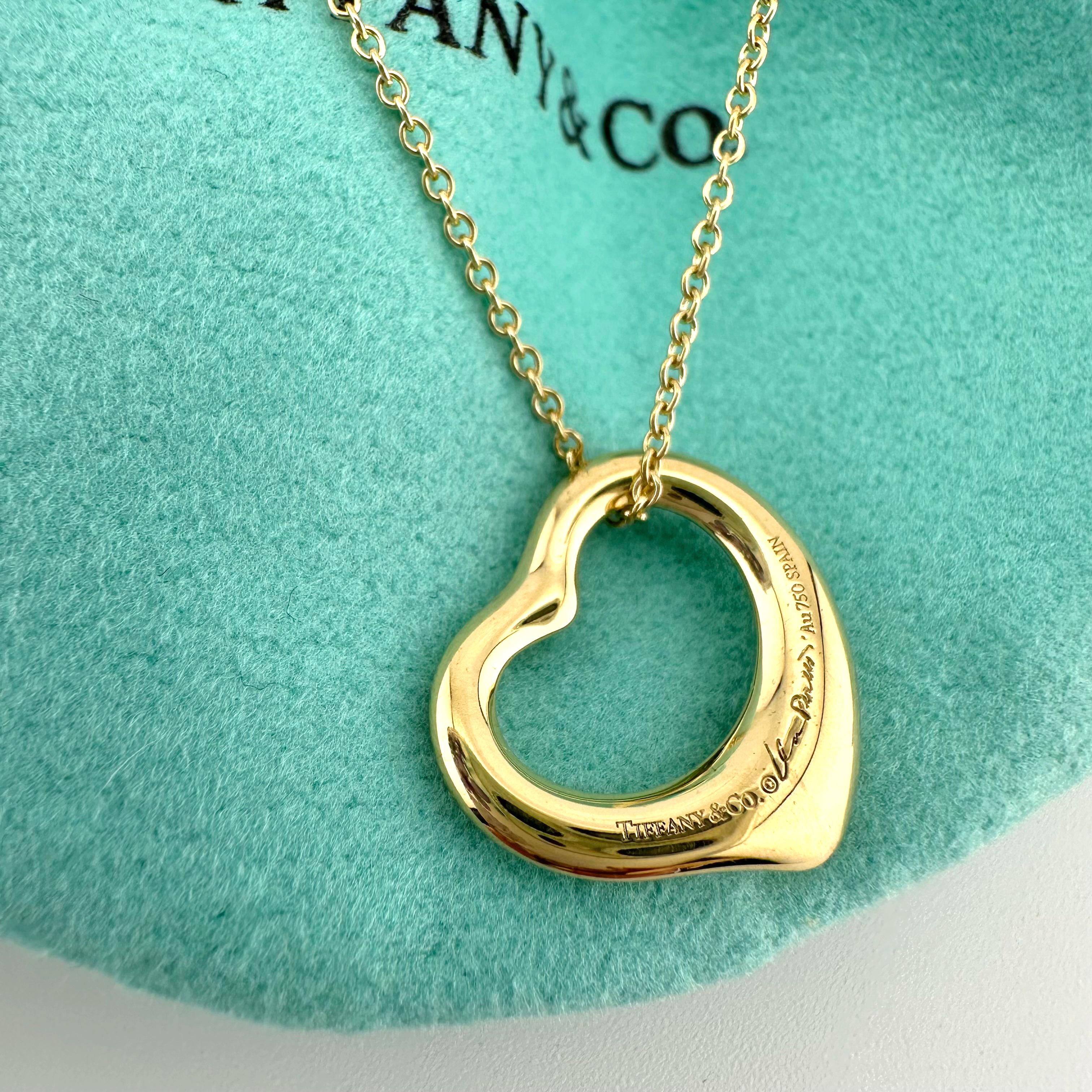 Tiffany & Co Elsa Peretti Open Heart Pendant Necklace
Style:  Pendant Necklace
Ref. number:  60018198
Metal:  18k Yellow Gold
Size / Measurements:  16'  Inches 
Hallmark:  ©PERETTI SPAIN TIFFANY&Co. Au750 - TIFFANY&Co.©ElsaPeretti Au750 SPAIN