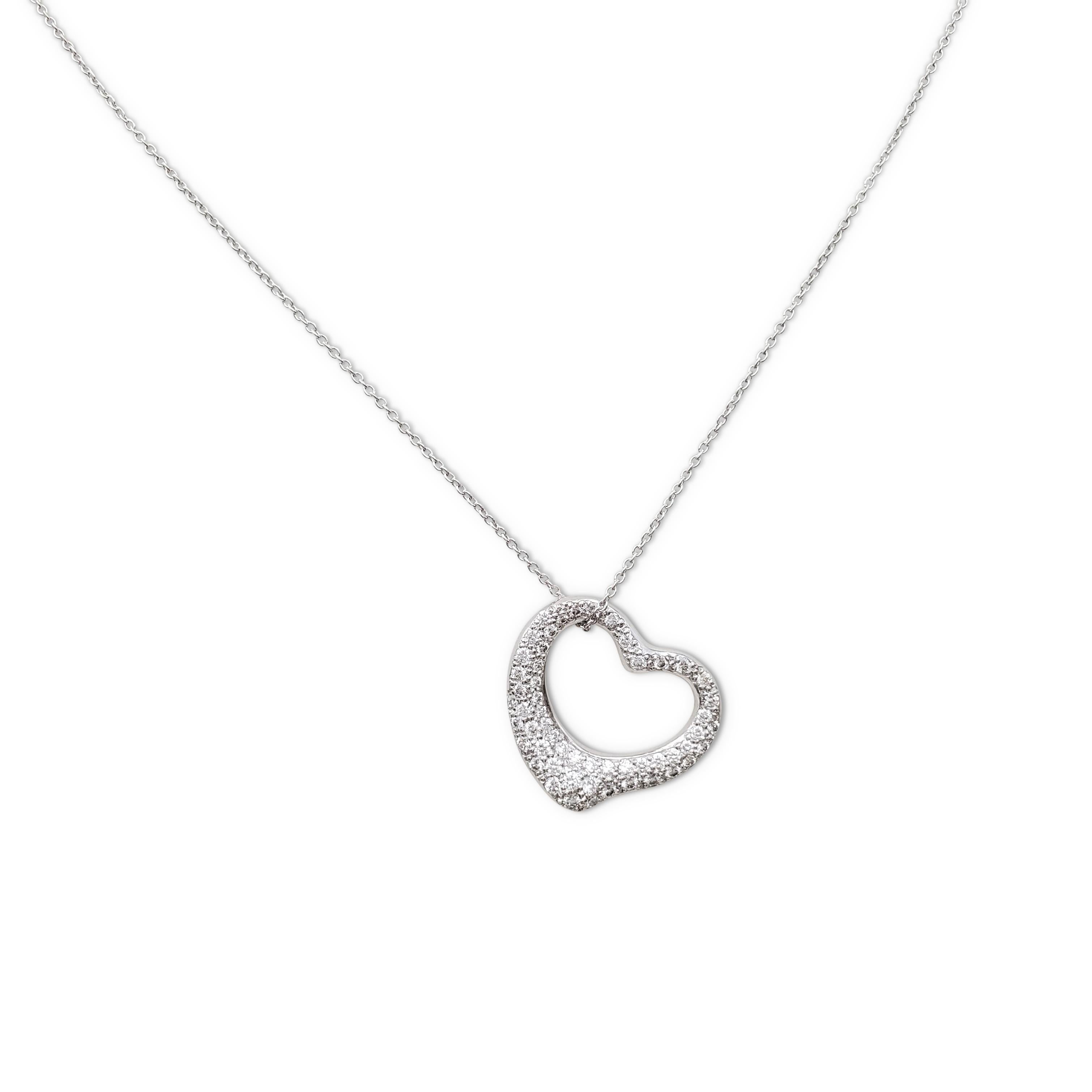 Authentic Elsa Peretti for Tiffany & Co. open heart pendant necklace crafted in platinum and set with an estimated 1.20 carats of sparkling round brilliant cut diamonds (E-F, VS clarity). Signed Tiffany & Co., Elsa Peretti, PT950, Spain. The