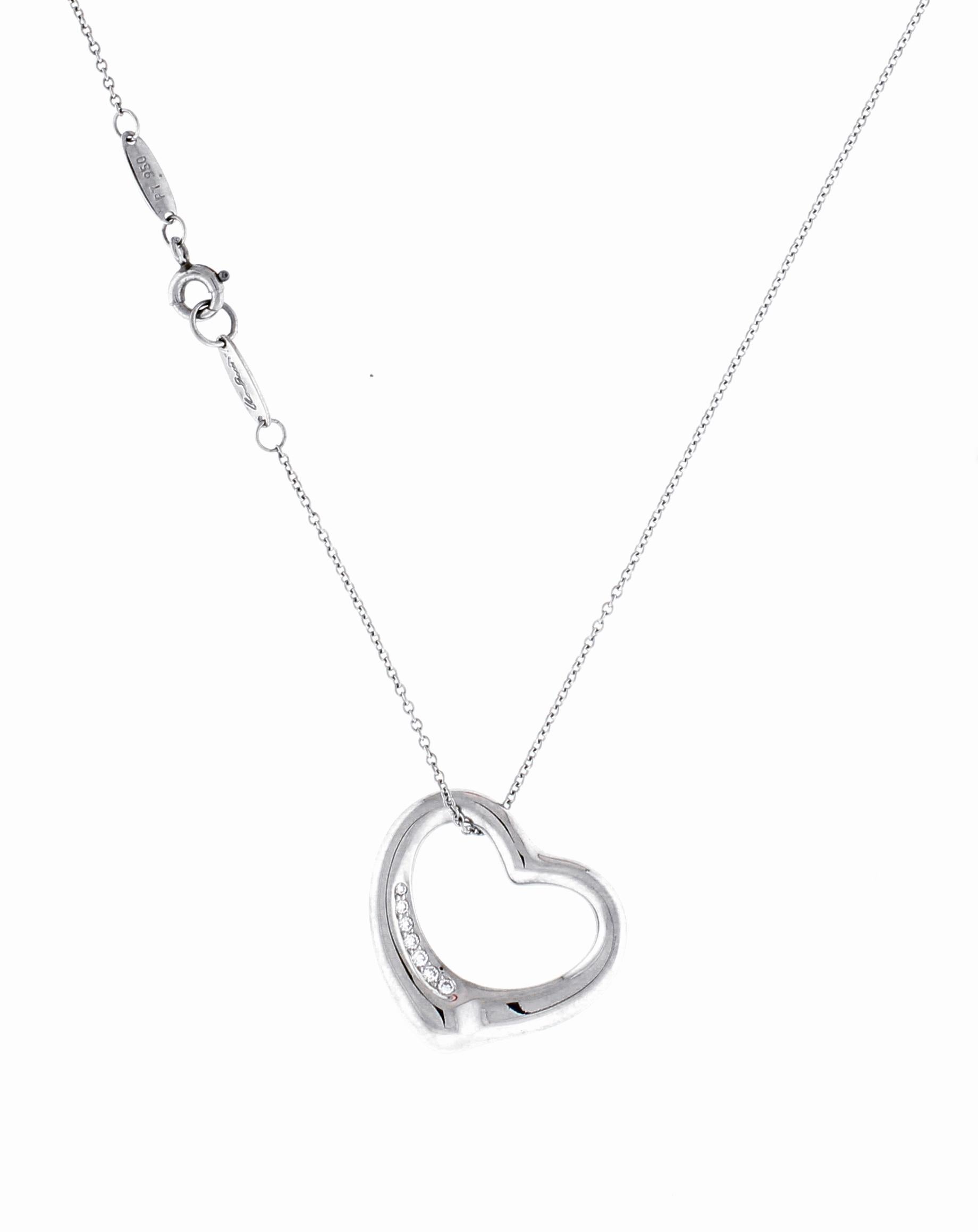 From Elsa Peretti for Tiffany & Co her iconic open heart  pendant necklace
♦ Designer: Elsa Peretti for Tiffany & Co
♦ Metal; Platinum
♦ 7 Diamonds=.30
♦ 7/8th of an inch across 
♦ Circa 1995
♦ 16 inch platinum chain
♦ Packaging: Pampillonia