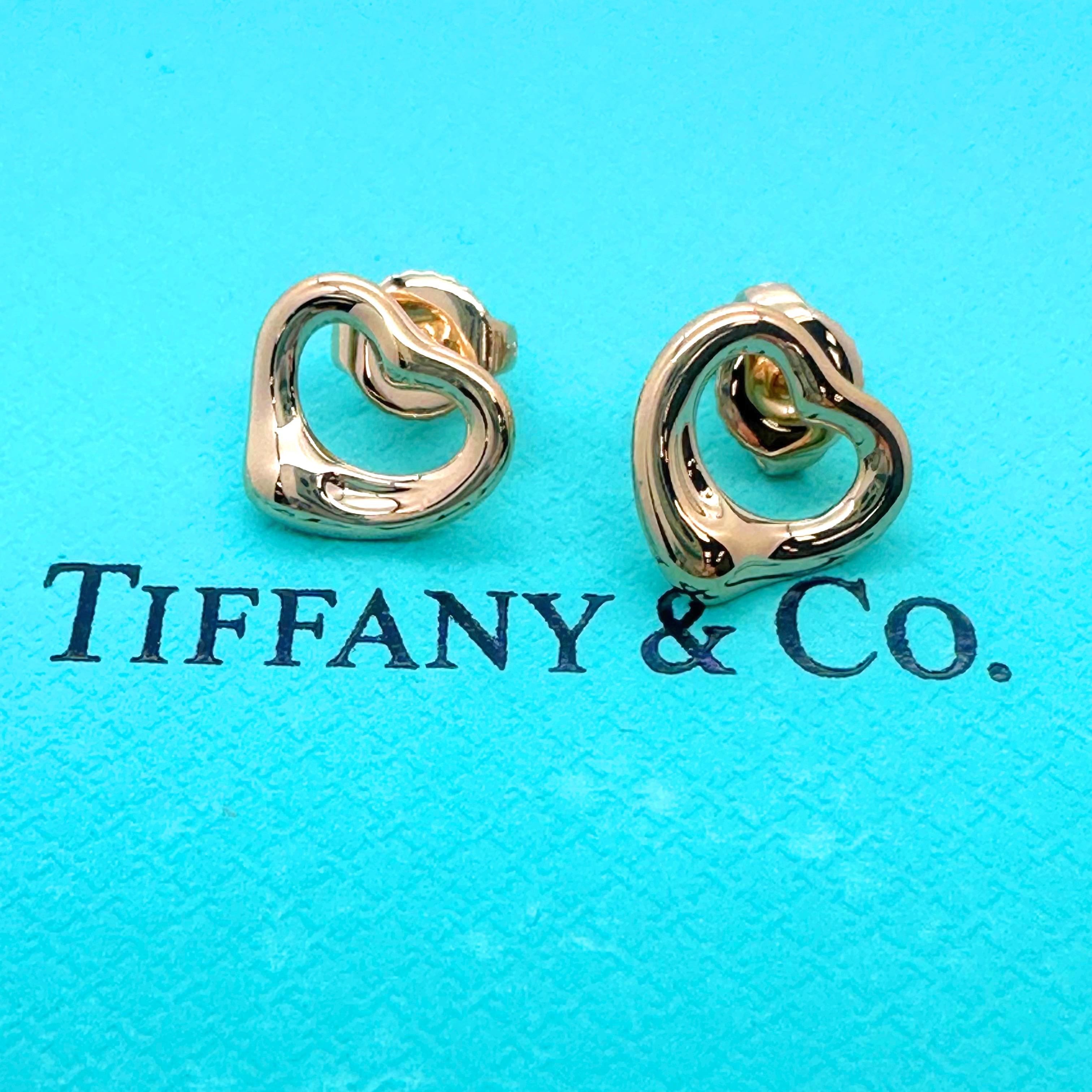 Tiffany & Co. Elsa Peretti Open Heart Stud Earrings
Style:  Stud for Pierced Ears
Ref. number:  60138029
Metal: 18k Rose Gold
Size:  11 mm
Hallmark:  TIFFANY&Co. ©Elsa Peretti Au750 SPAIN
Includes:  T&C Jewelry Pouch & Outer Presentation Box
EST.