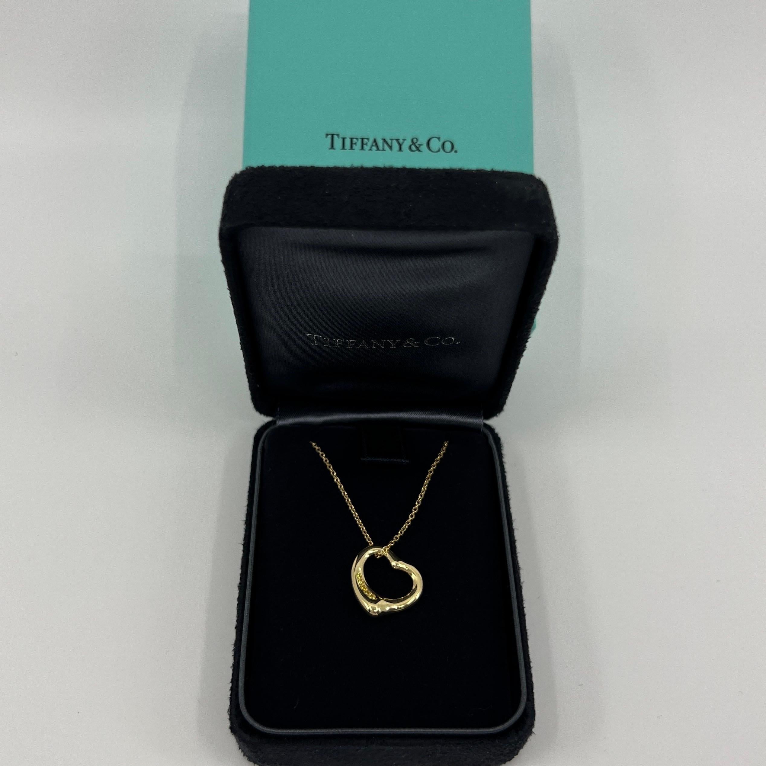 Rare Vintage Tiffany & Co. Elsa Peretti Open Heart Yellow Diamond 18k Yellow Gold Pendant Necklace.

A beautiful, authentic Tiffany & Co open heart pendant from the stylish and popular Elsa Peretti range. 

The pendant and chain are 18k solid gold