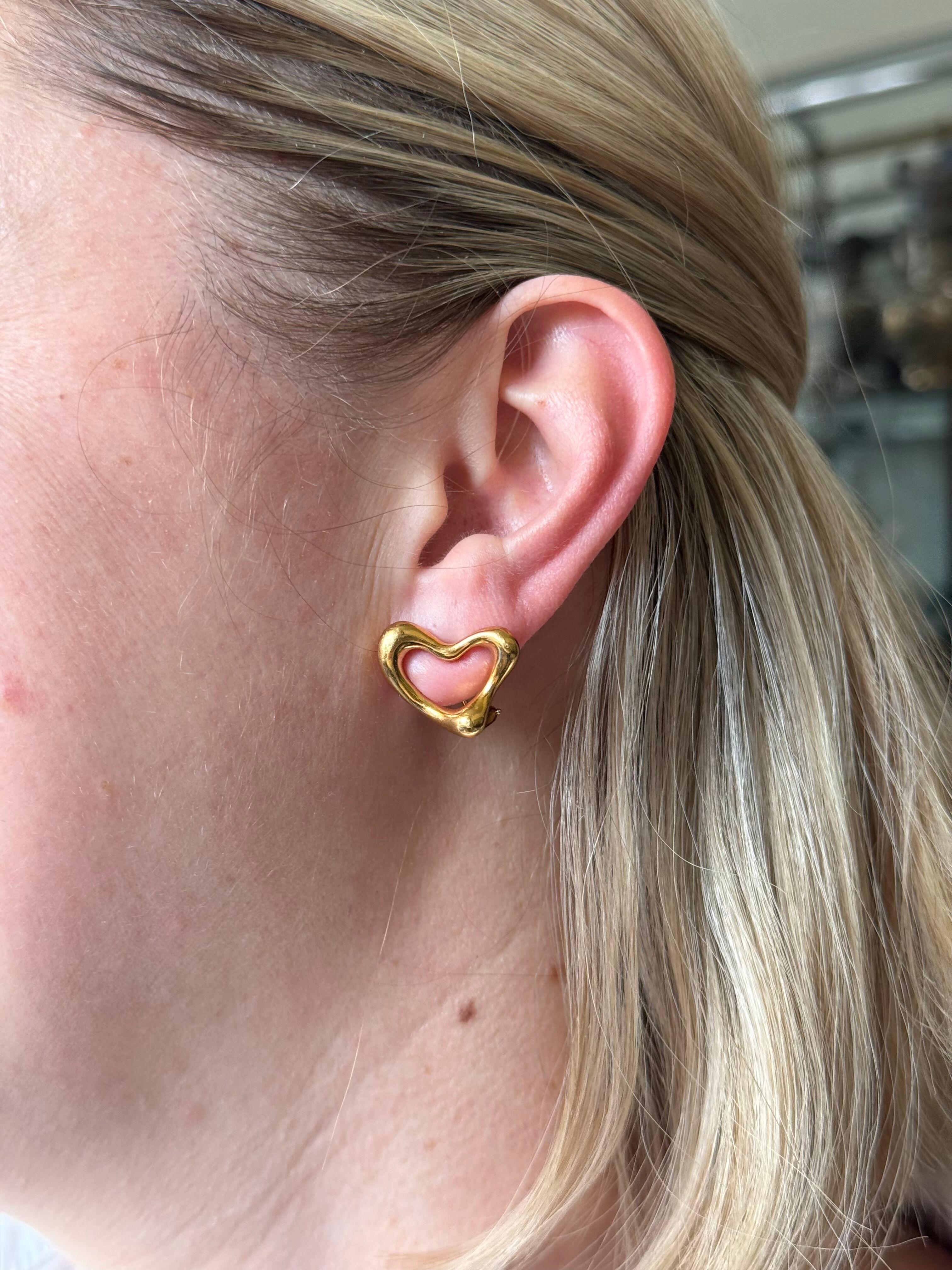 Tiffany & Co Elsa Peretti Open Heart 18k Yellow Gold Earrings

Pair of 18k yellow gold open heart earrings, designed by Elsa Peretti for Tiffany & Co. Earrings measure 16mm x 23mm. With posts, for pierced ears. Marked on the back - Tiffany & Co,
